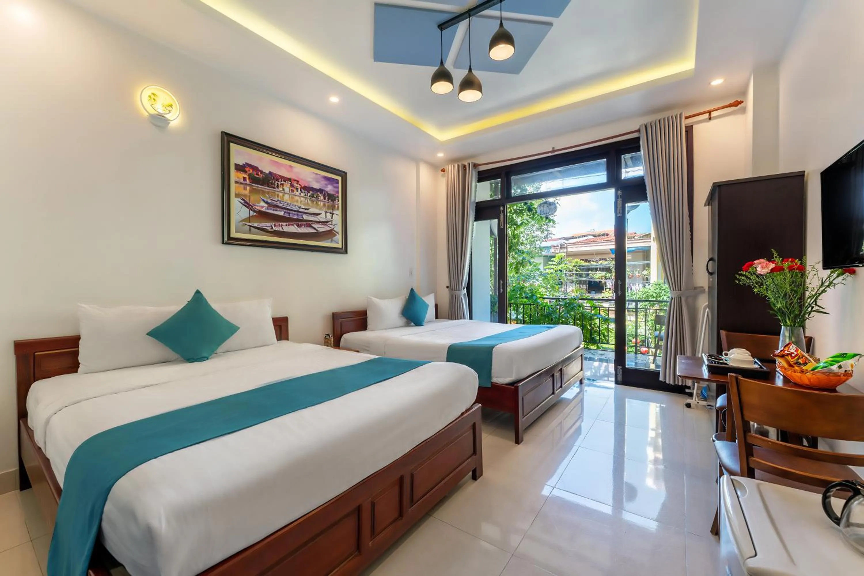 Communal lounge/ TV room, Bed in Rockmouse Centre River Villa Hoi An