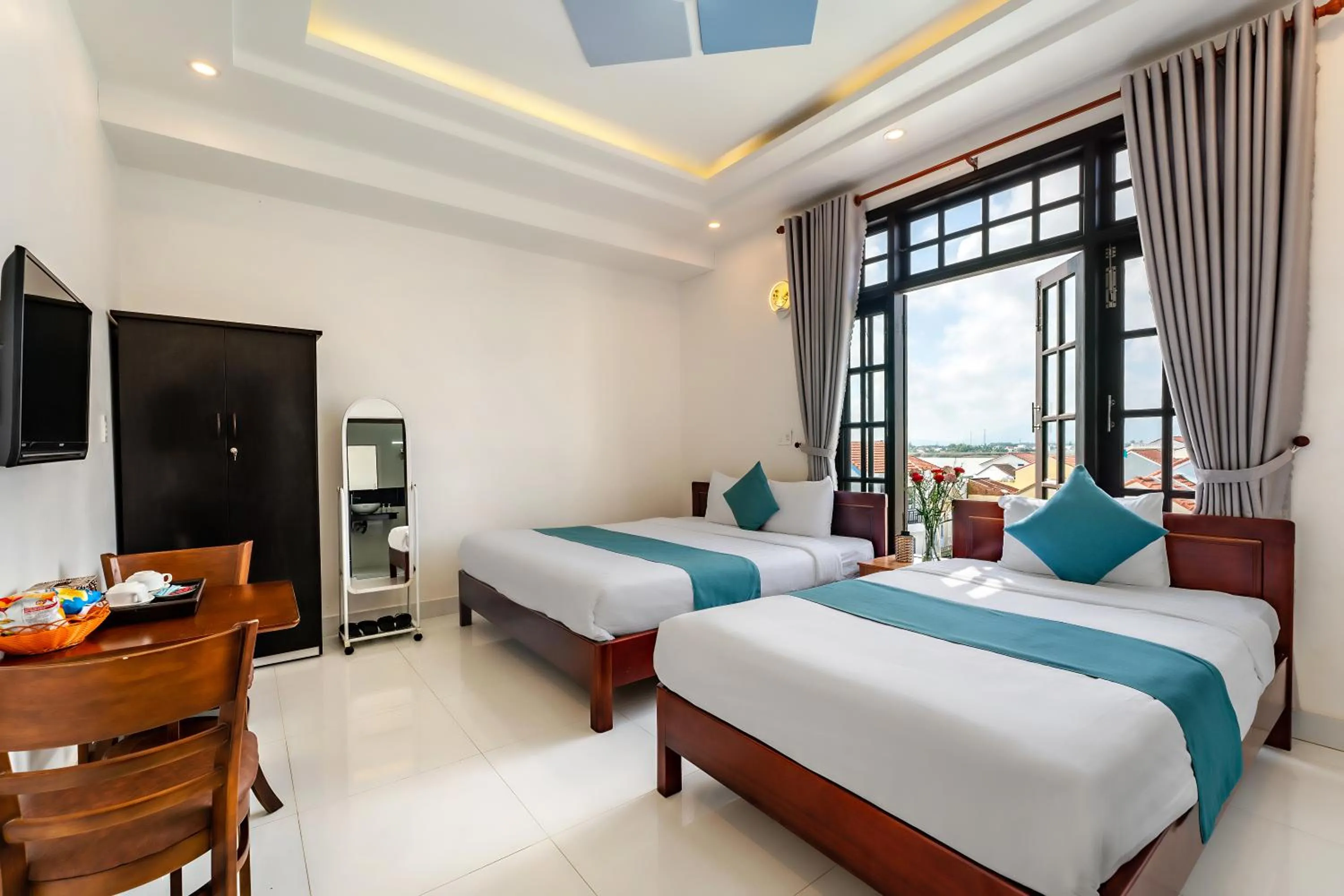 Communal lounge/ TV room, Bed in Rockmouse Centre River Villa Hoi An