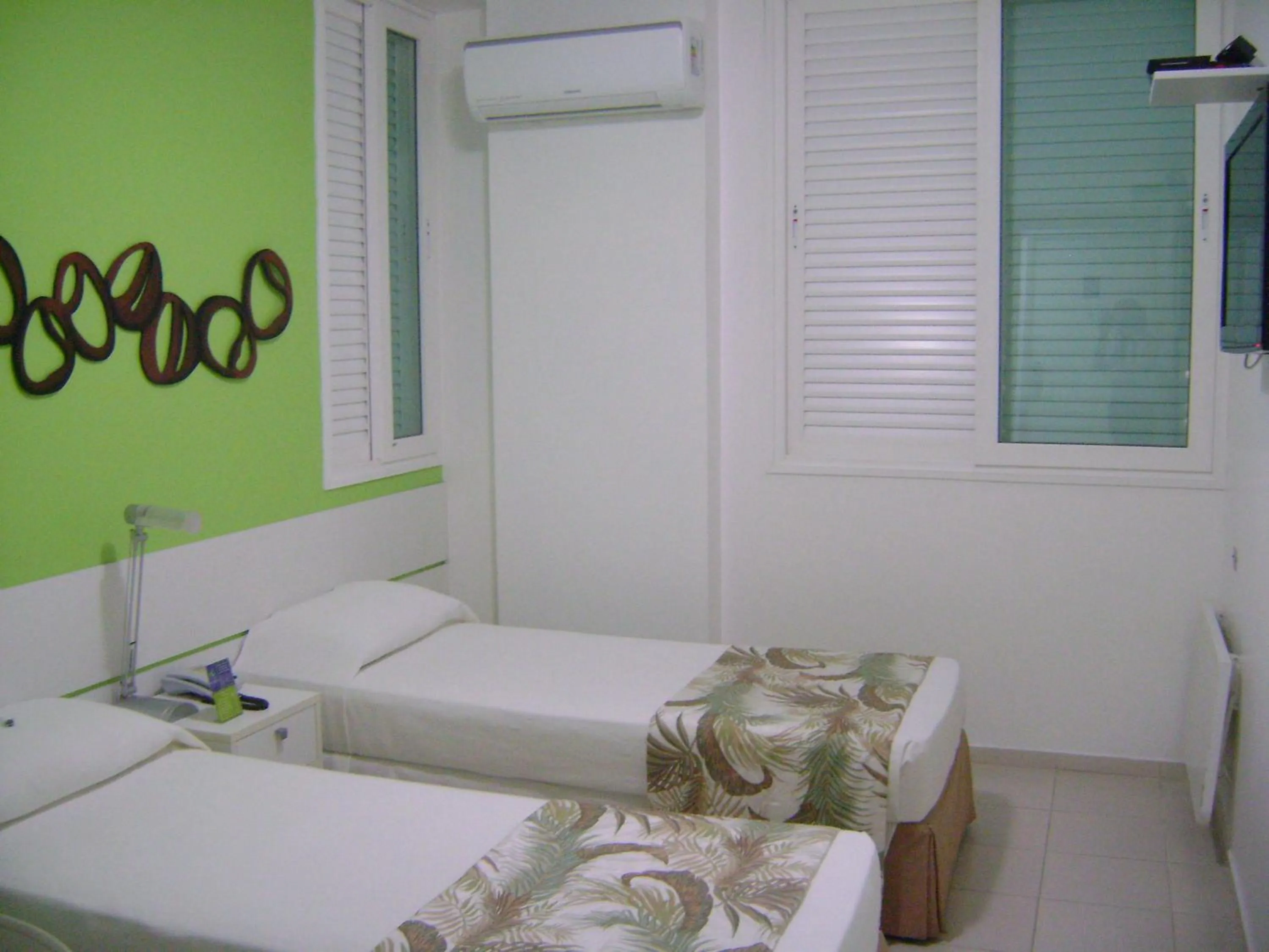 Bed in Coqueiros Express Hotel