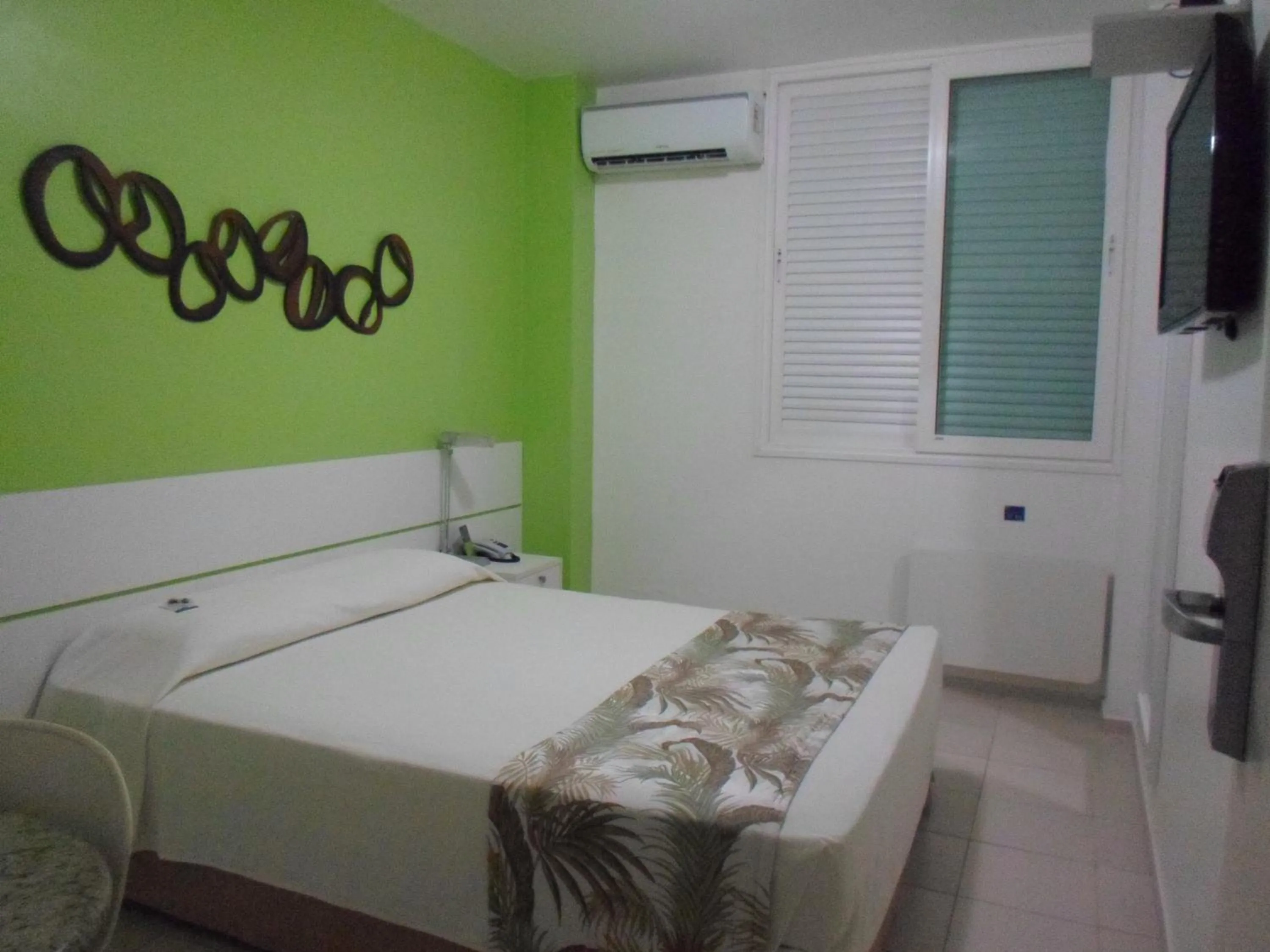 Bed in Coqueiros Express Hotel