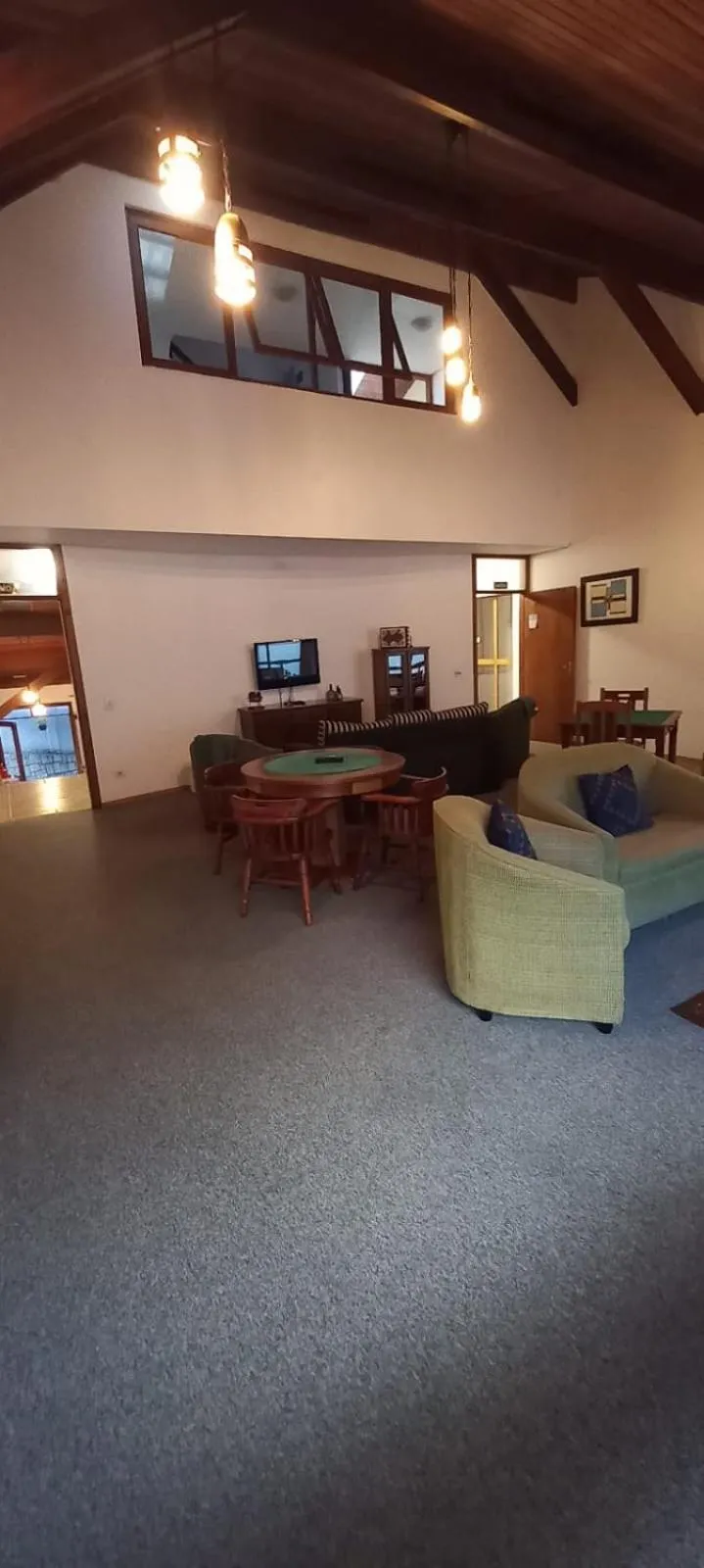 Communal lounge/ TV room in Pousada Condado Brasileiro