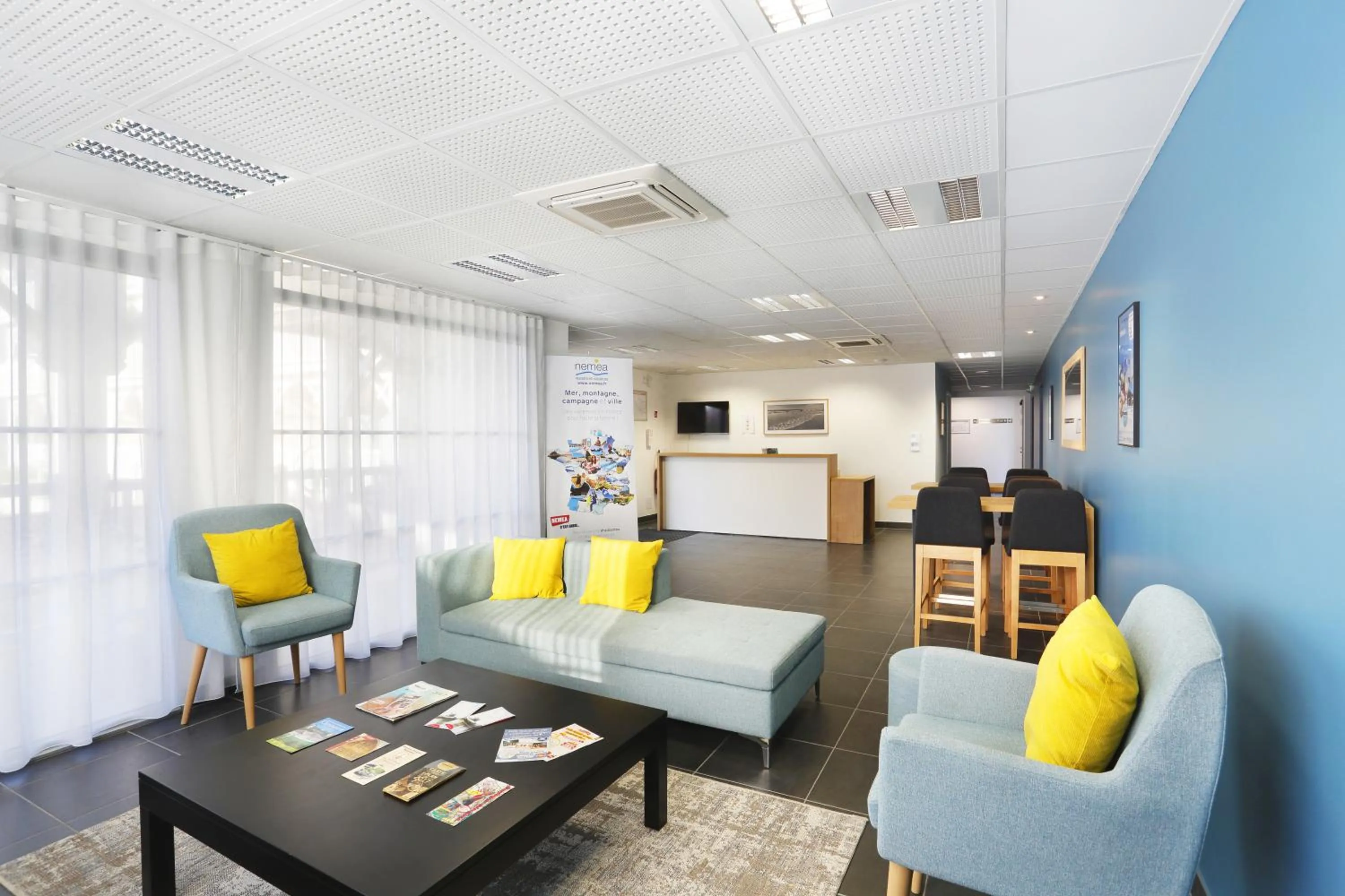 Communal lounge/ TV room in Résidence Néméa Le Marché de la Plage