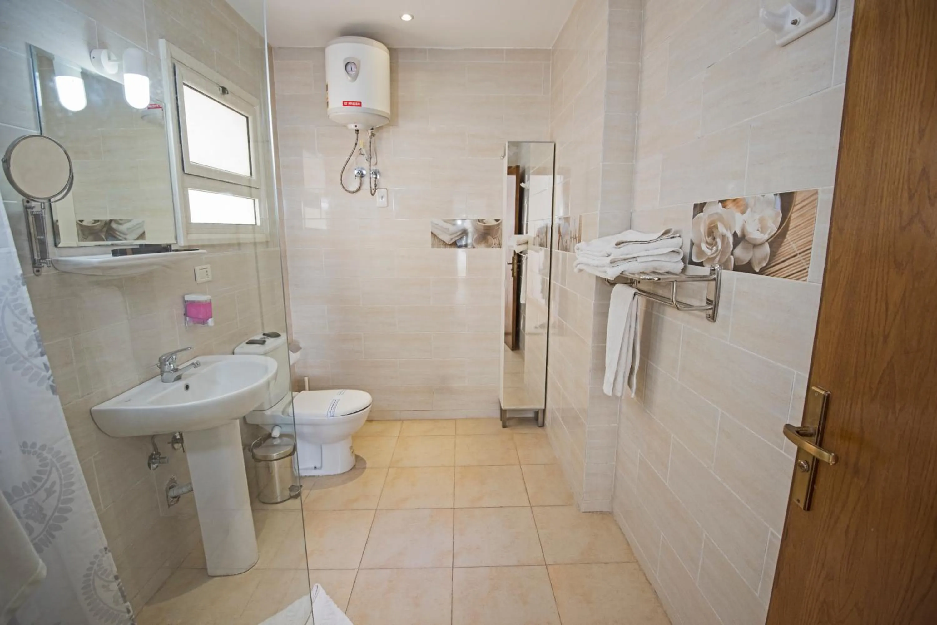 Toilet in Lilly Apartments