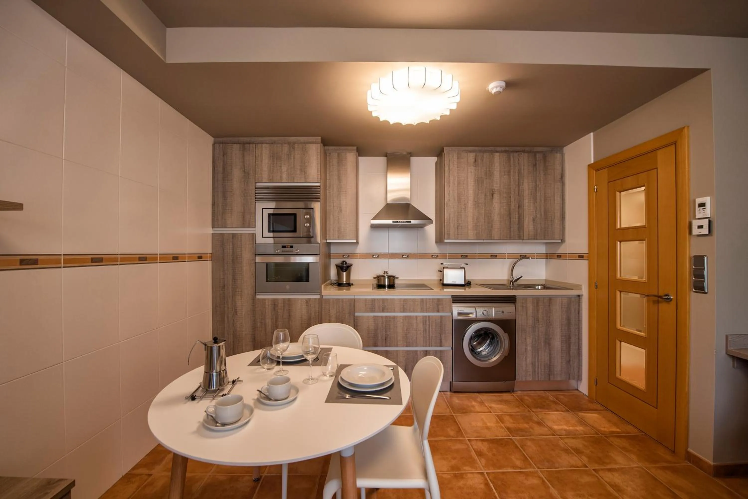 Kitchen or kitchenette in Apartamentos VIDA Mar de Laxe