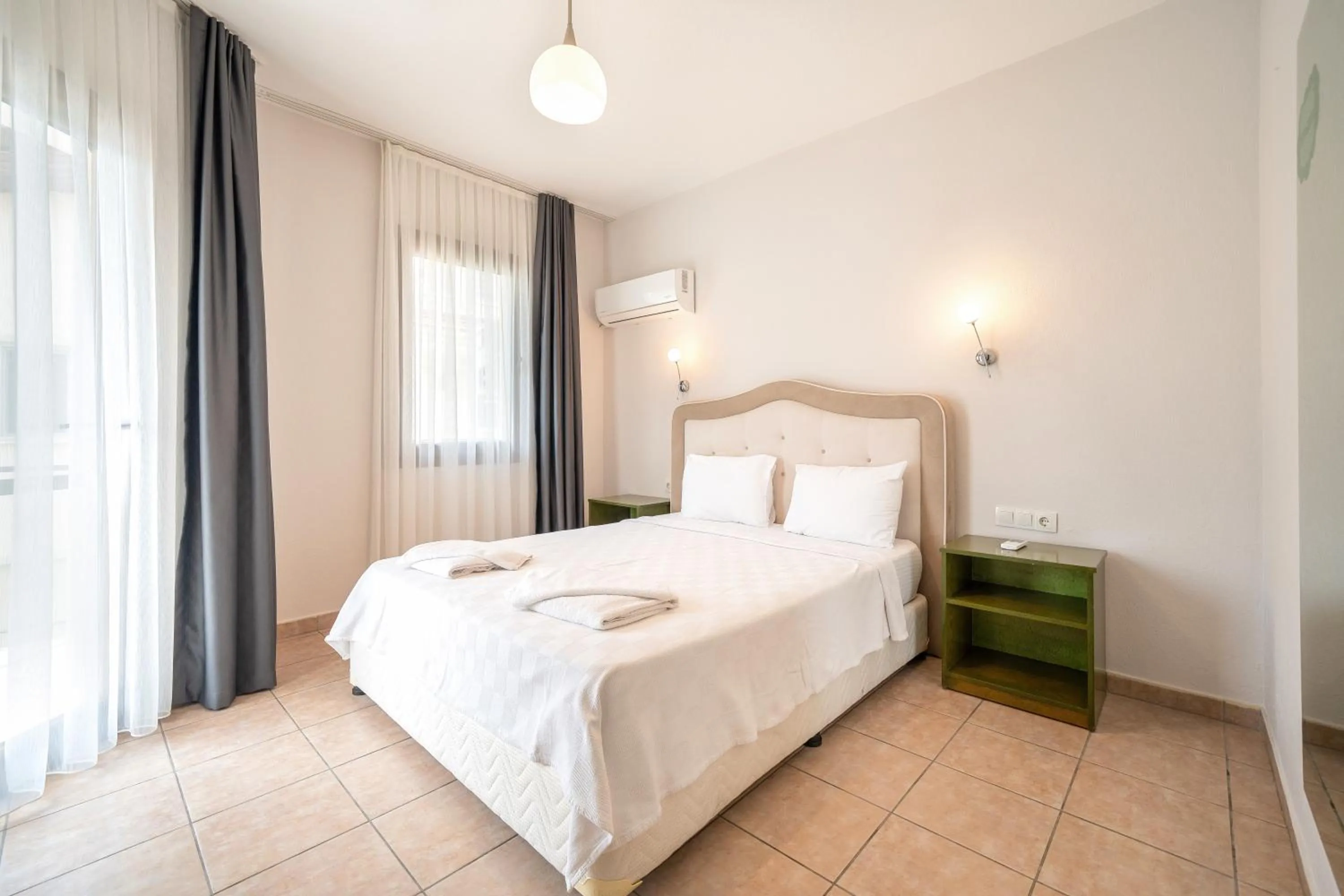 Bed in Dedeminn Garden Hotel