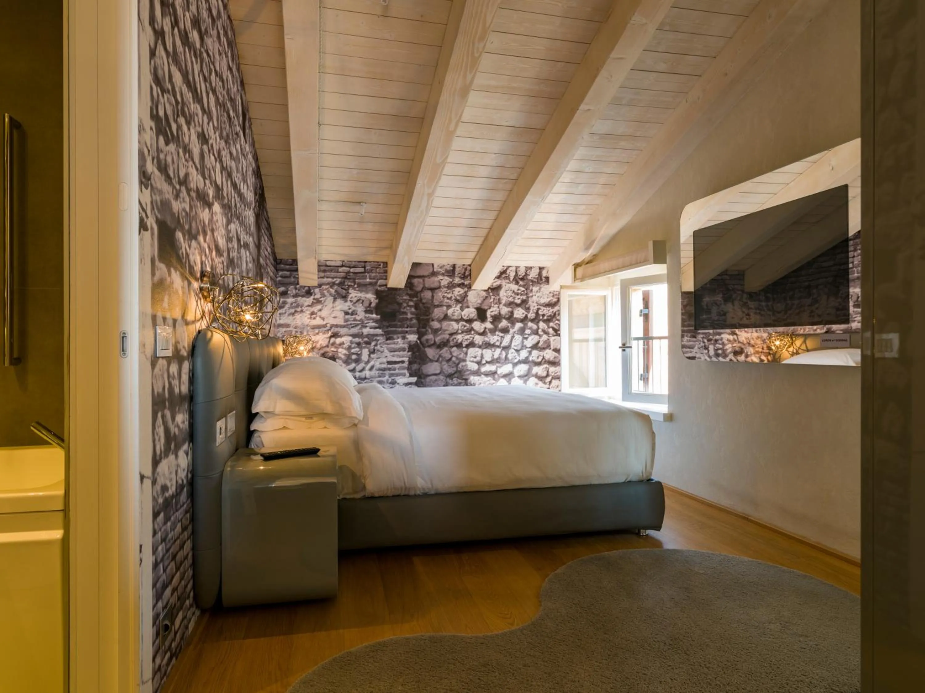 Bed in Lords of Verona Luxury Apartments