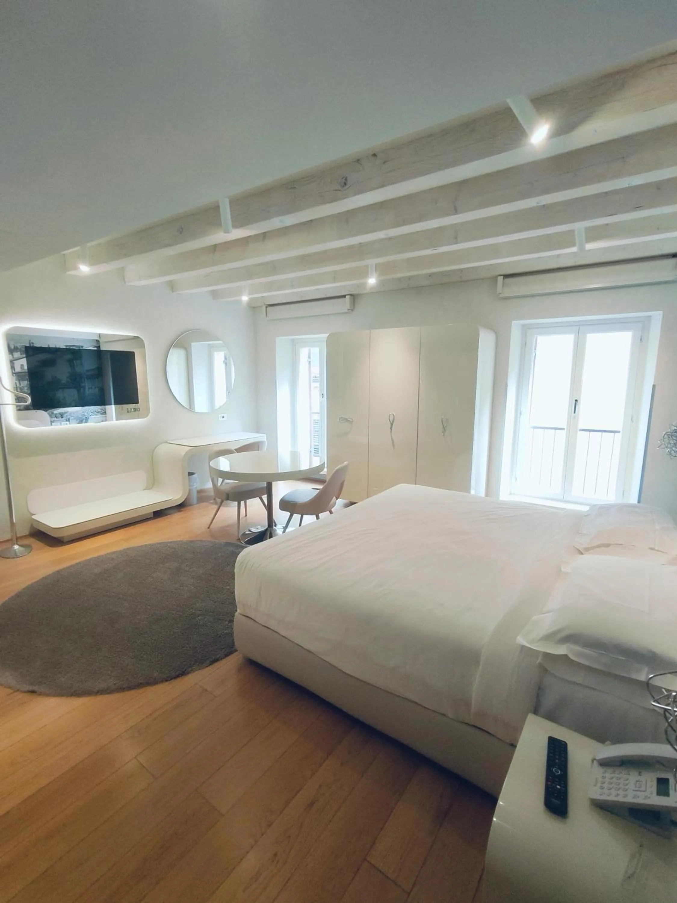 Bed in Lords of Verona Luxury Apartments