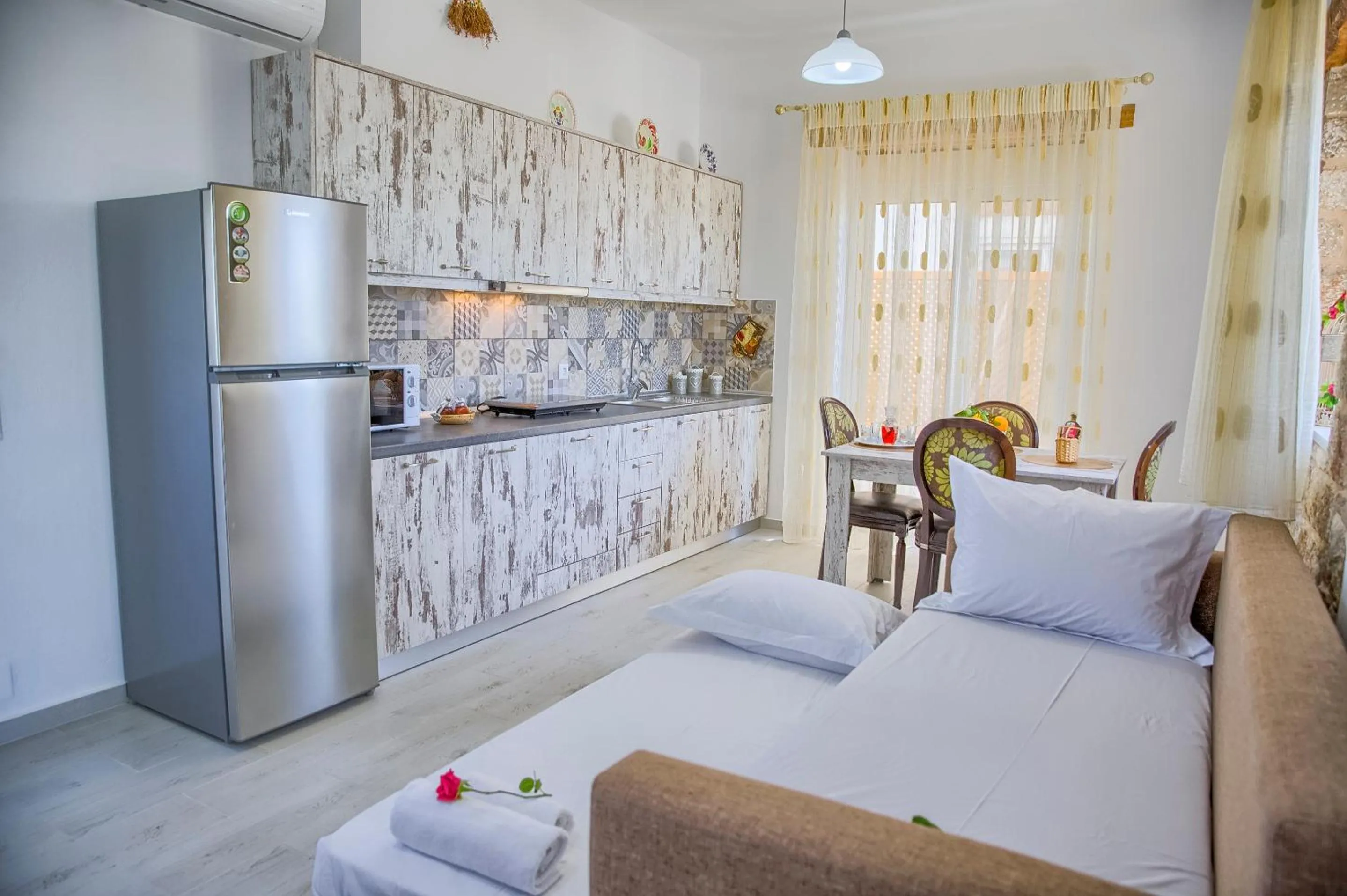 Bed in Haraki Stone Apartments