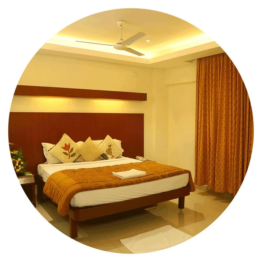 Bedroom, Bed in Dhanunjayas Luxury Hotel