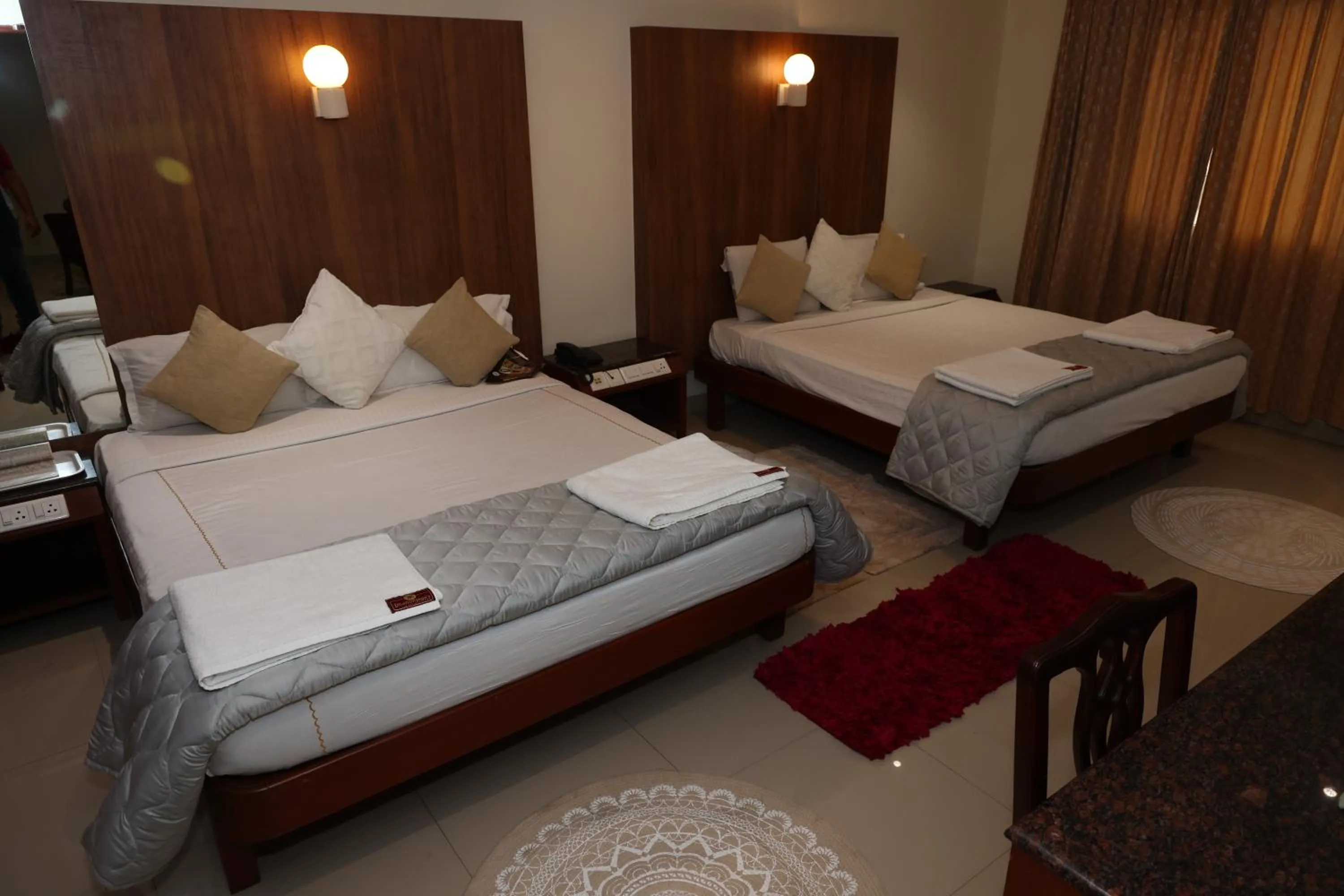 Bed in Dhanunjayas Luxury Hotel