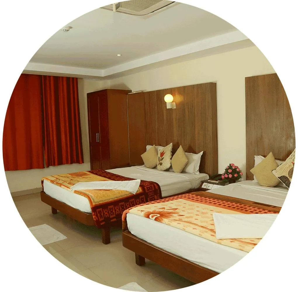 Bedroom, Bed in Dhanunjayas Luxury Hotel