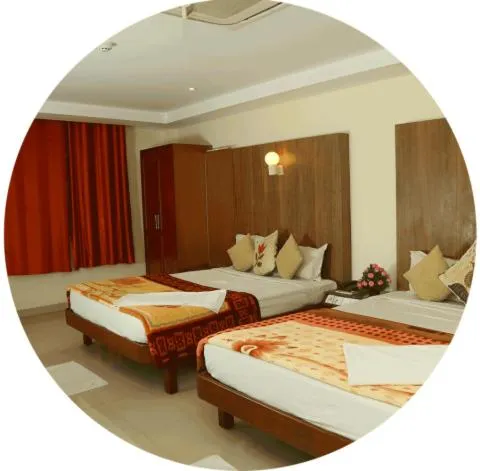 Bedroom, Bed in Dhanunjayas Luxury Hotel