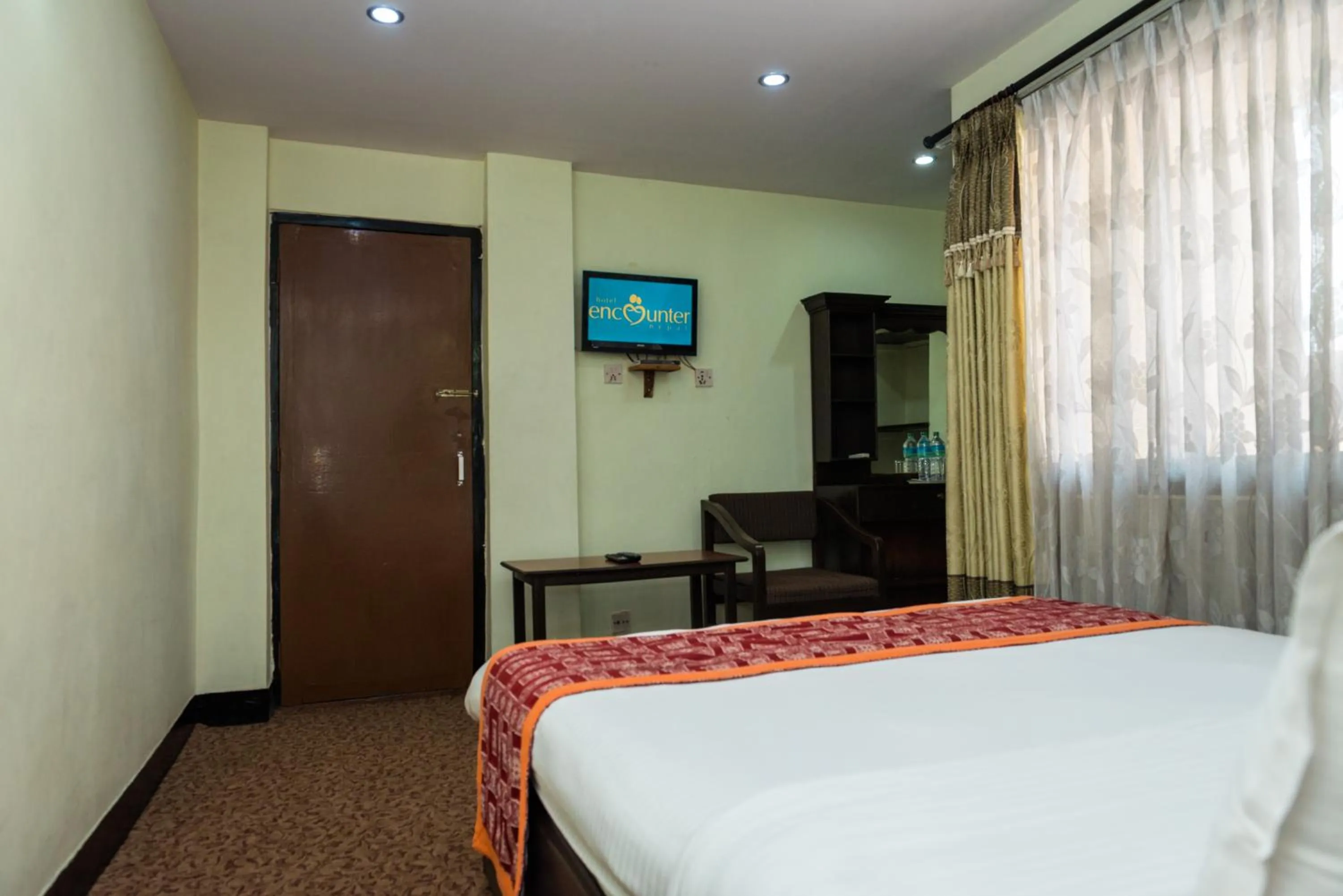 TV and multimedia, Bed in Hotel Encounter Nepal & Spa