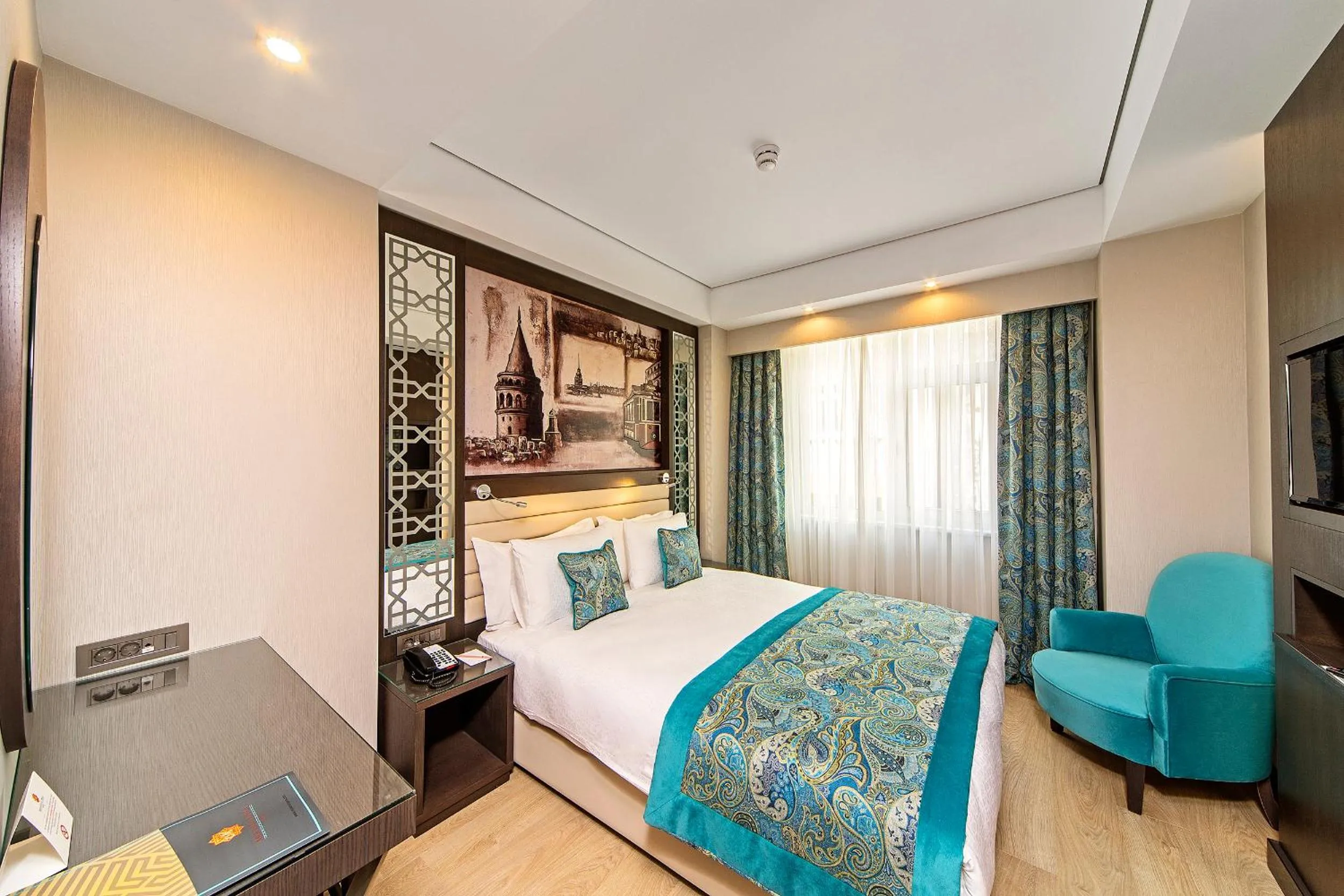 Bed in Mukarnas Taksim Hotel