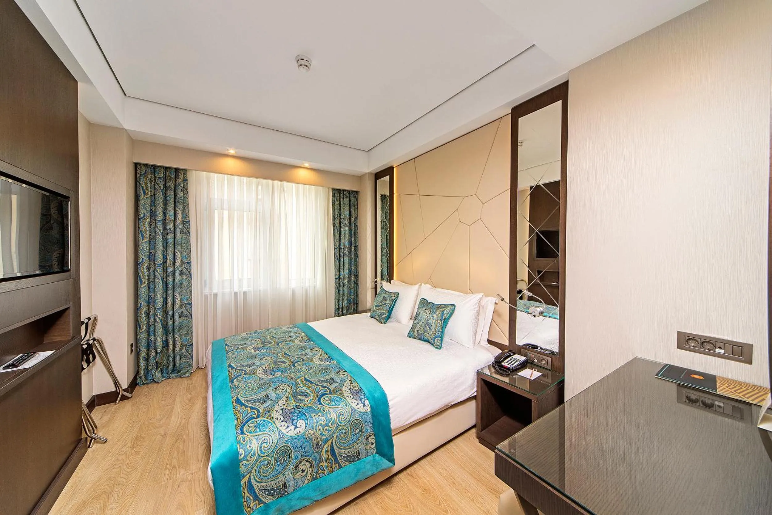 Bed in Mukarnas Taksim Hotel