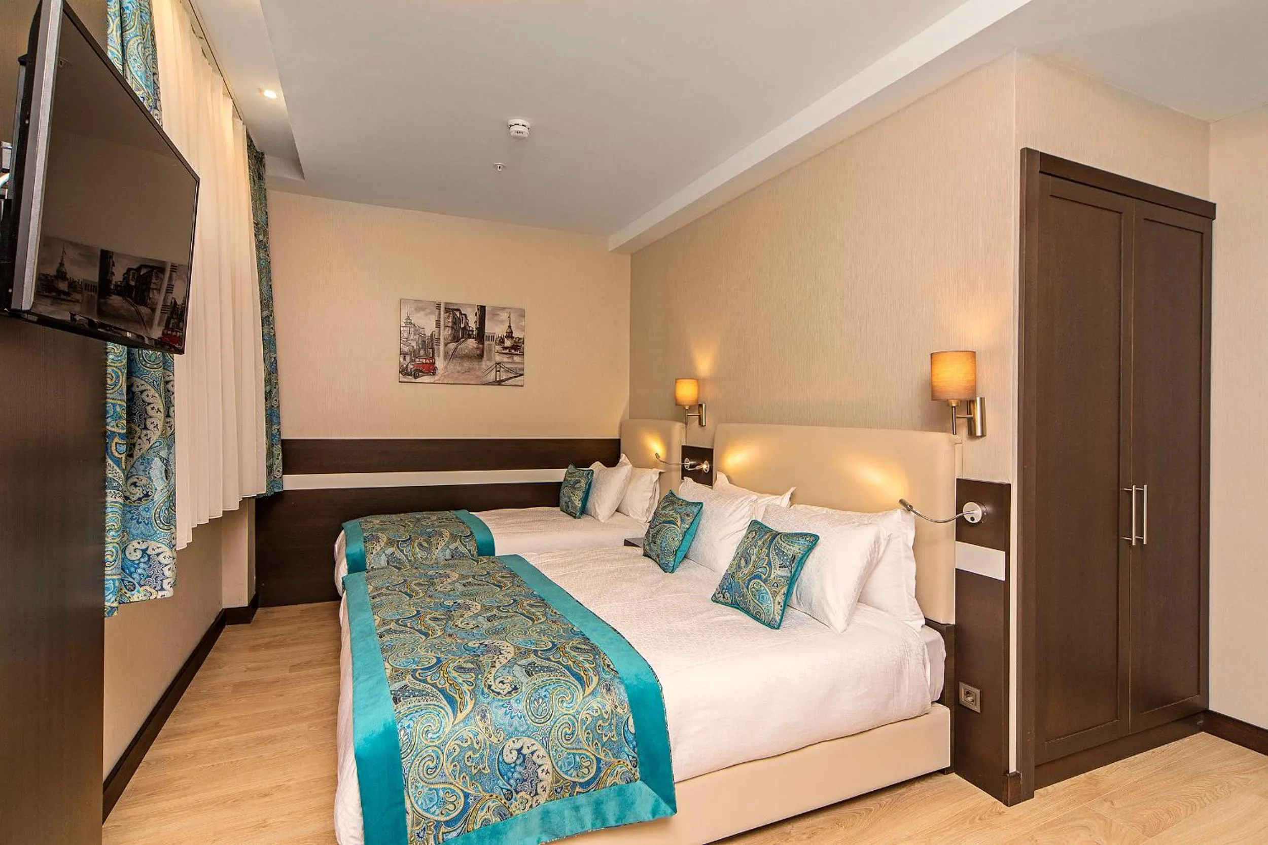 Bed in Mukarnas Taksim Hotel