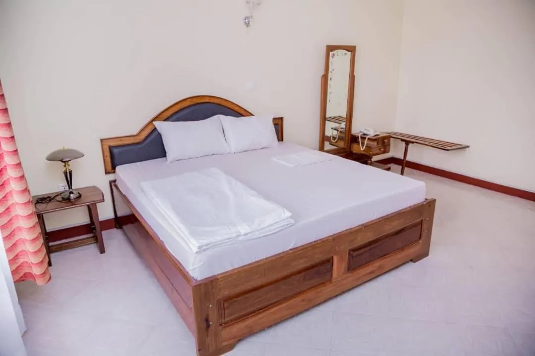 Bed in Kilimanjaro Crane Hotels & Safaris