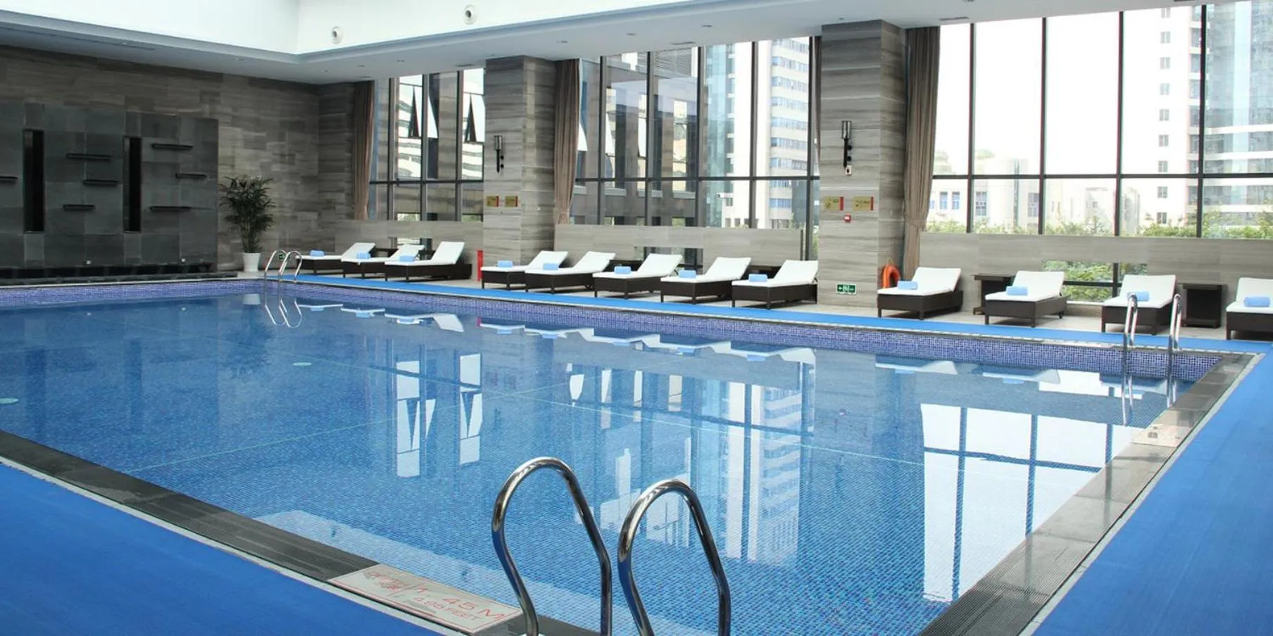 Swimming pool in Crowne Plaza Shenzhen Longgang City Centre by IHG