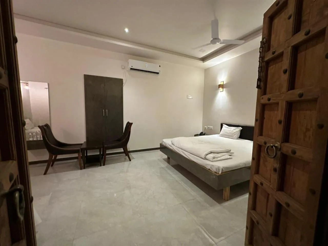 Seating area, Bed in Hotel Surbhi