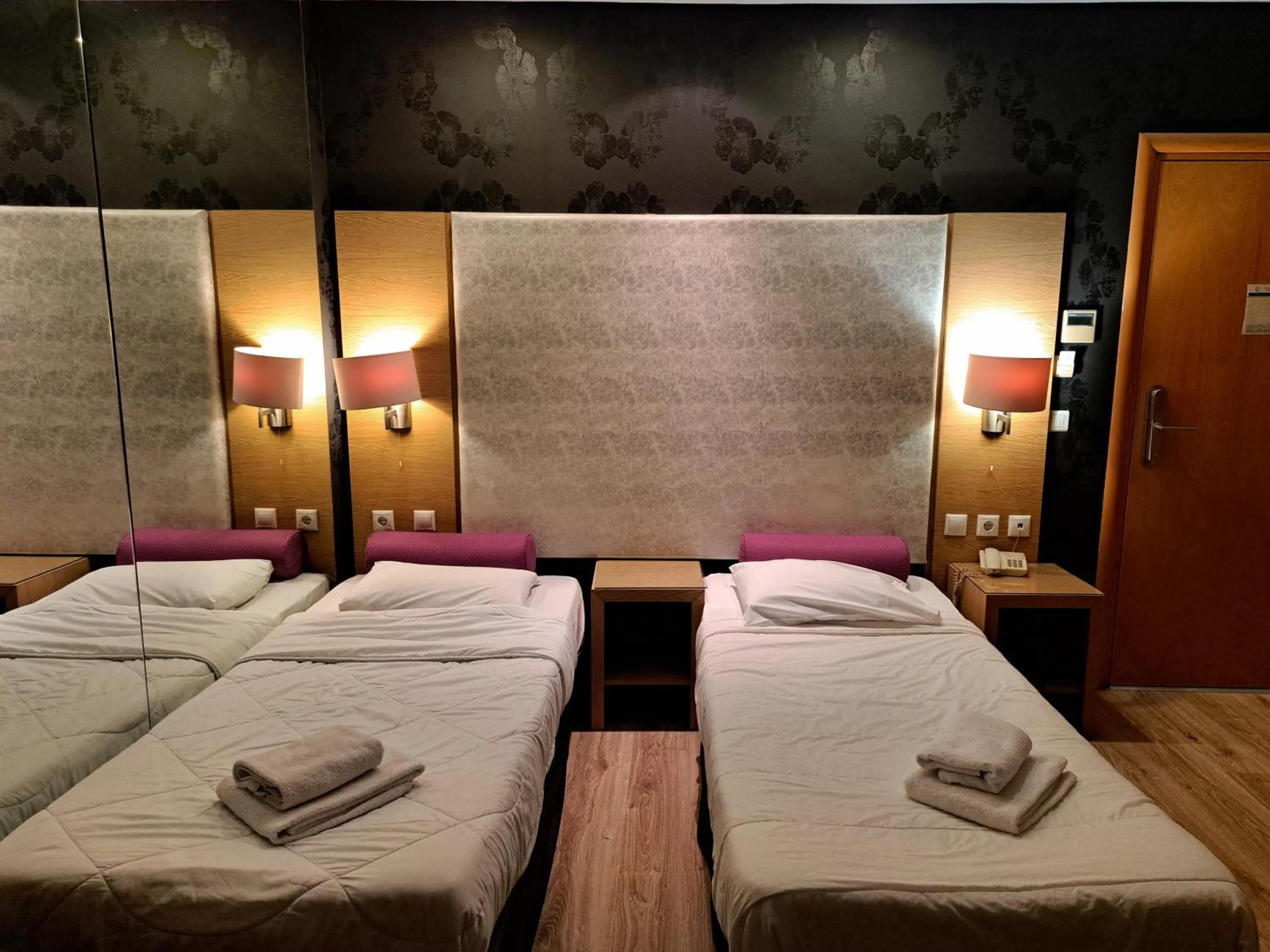 Bed in Nefeli Hotel Alimos