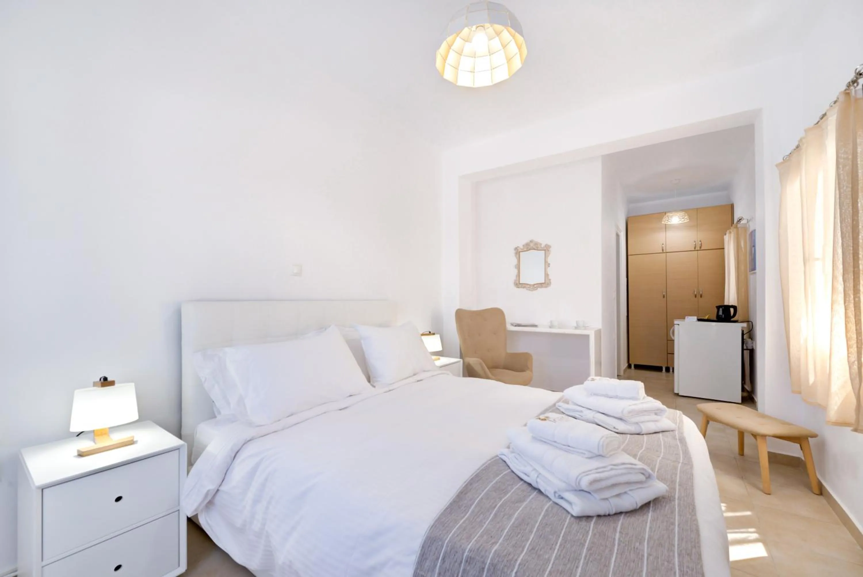 Bed in Iriana Suites