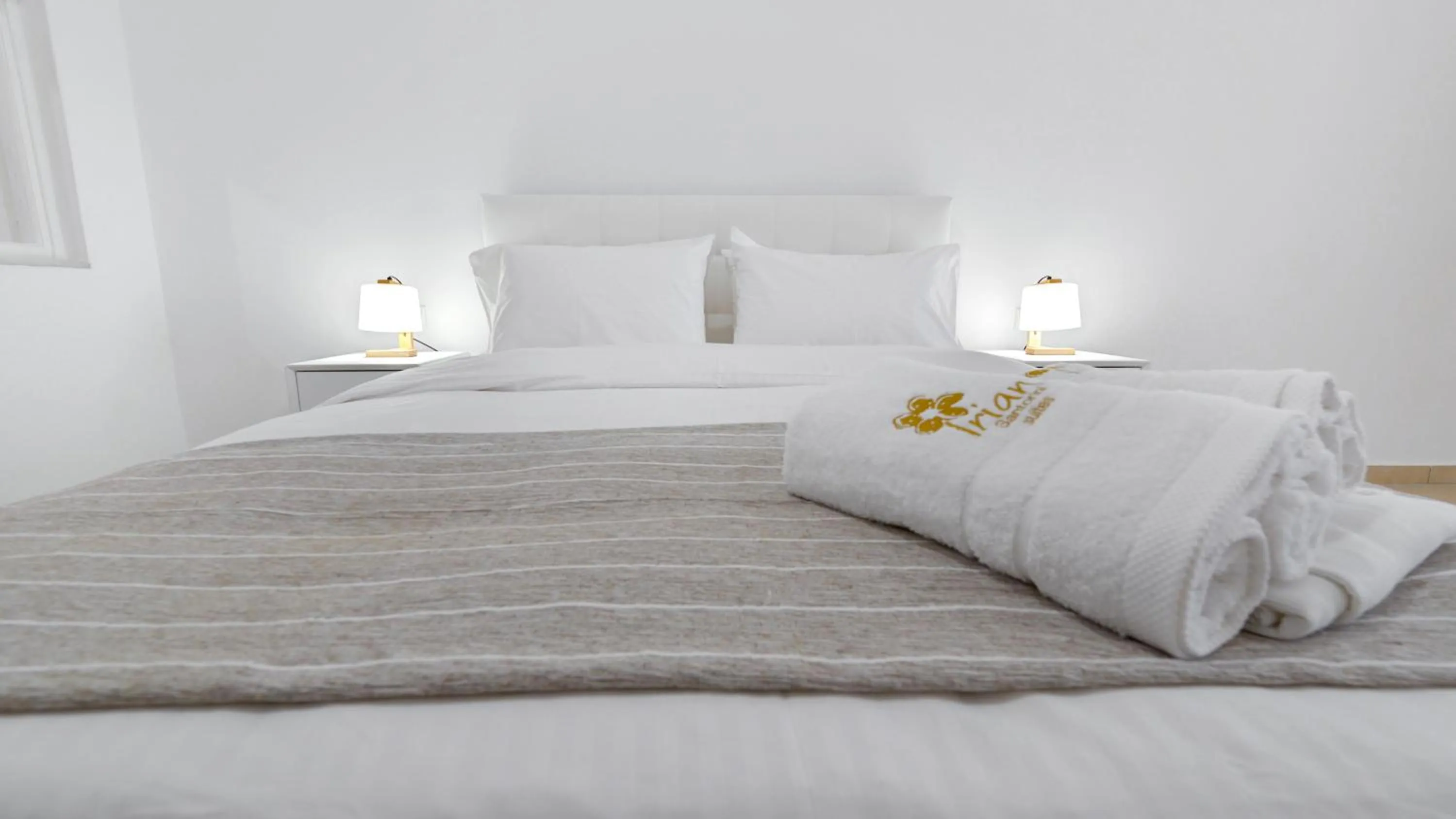 Bed in Iriana Suites