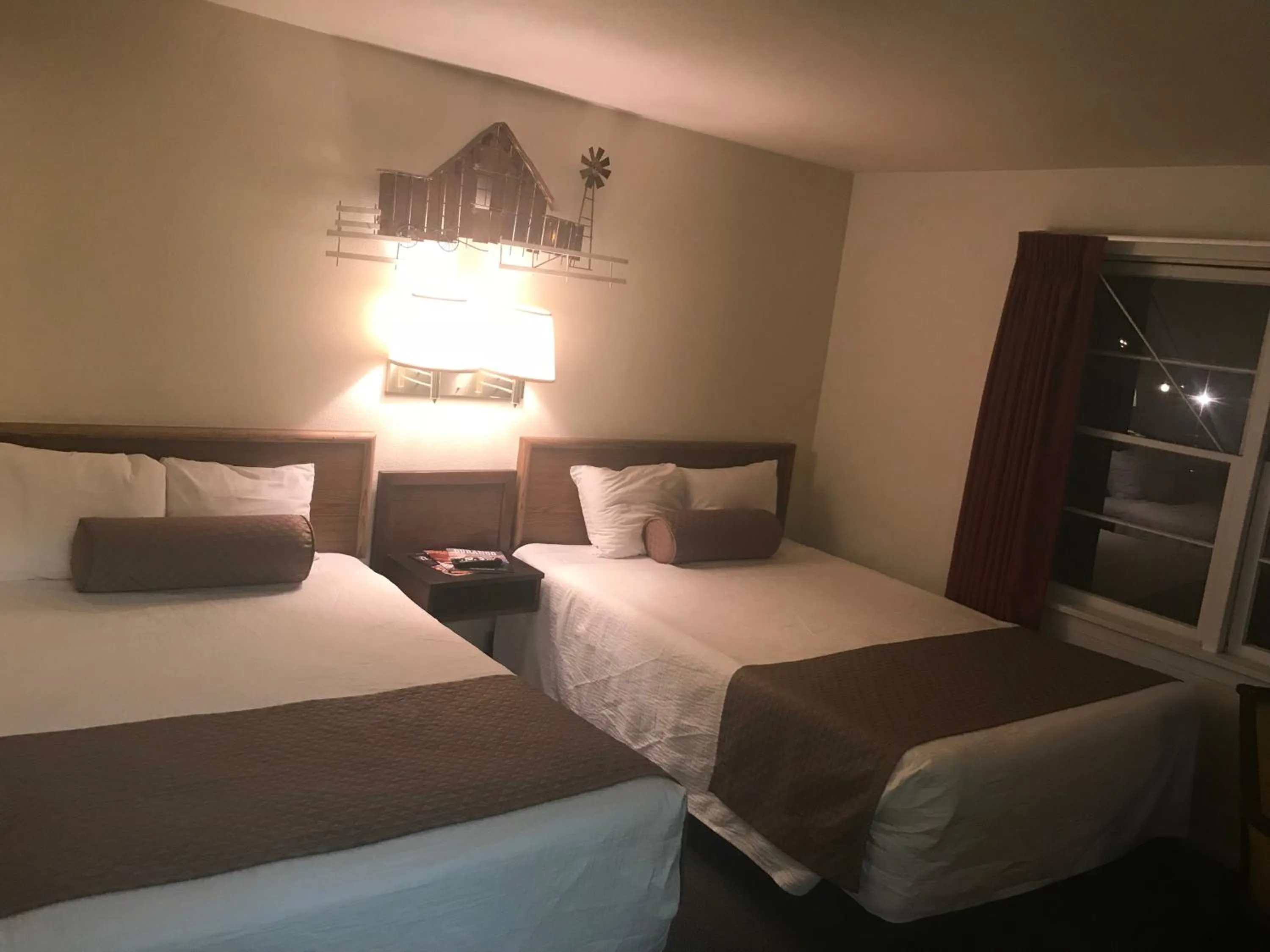 Bed in Caboose Motel & Gift Shop