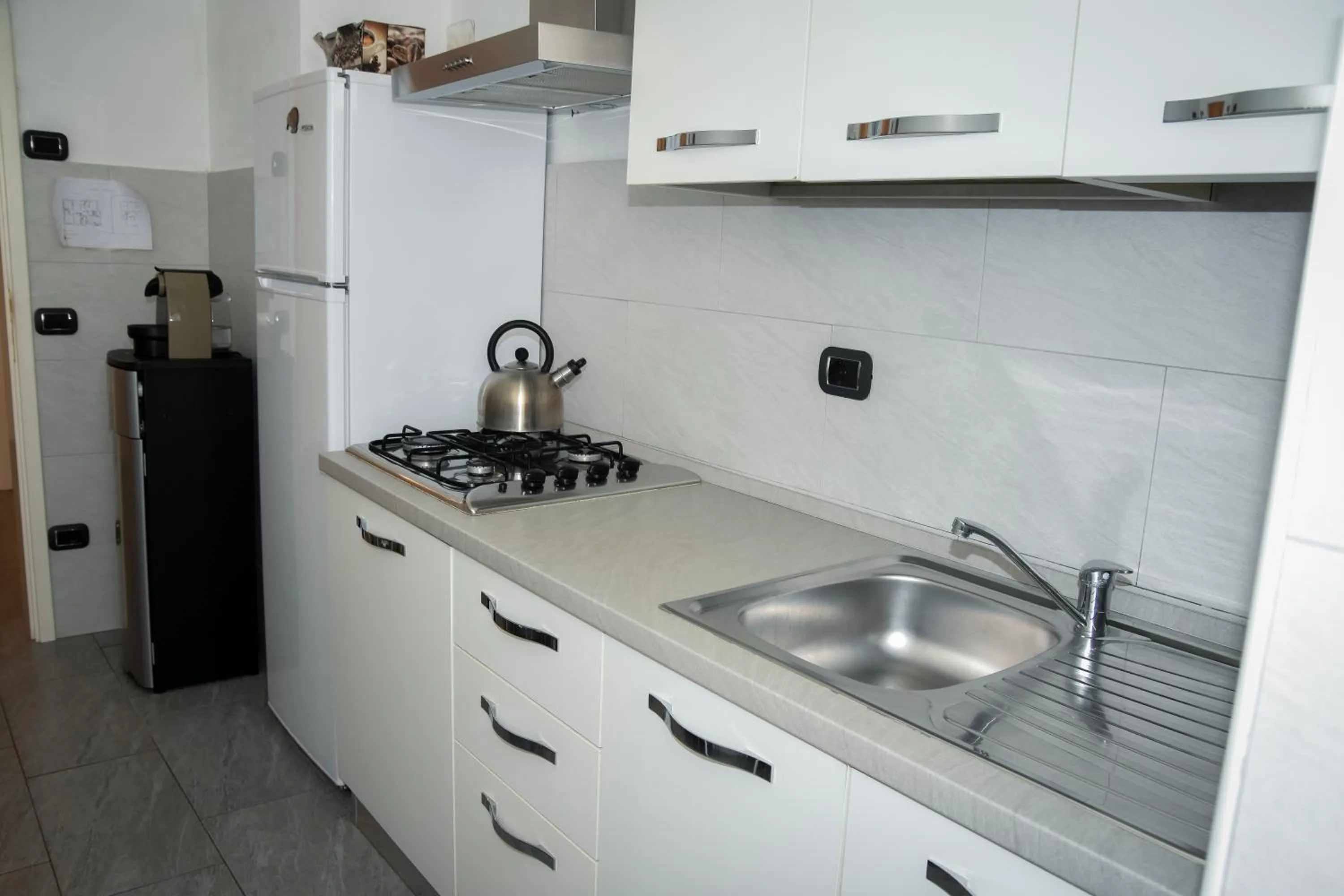 Kitchen or kitchenette in Affittacamere Delfo