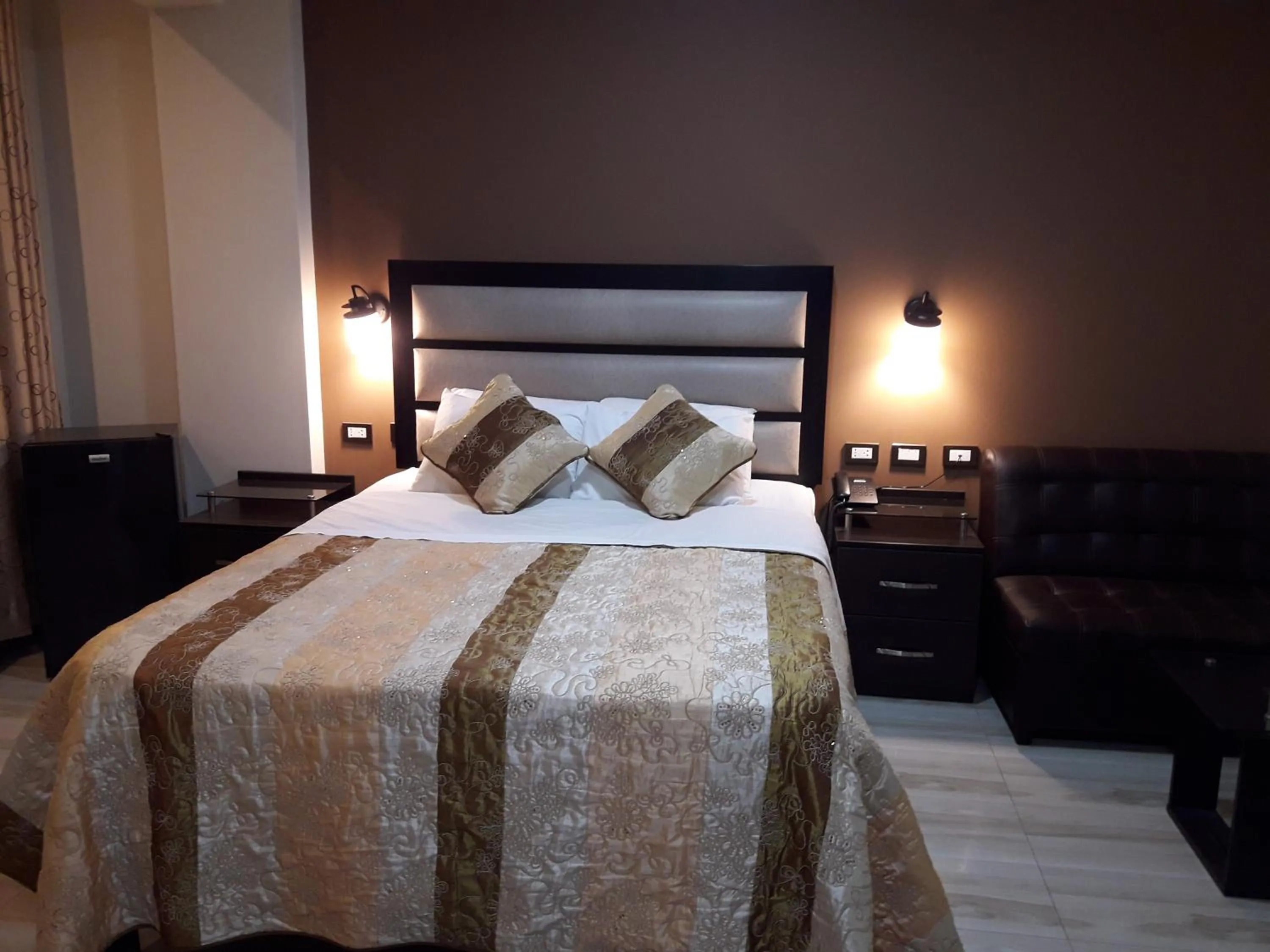 Bed in Gavina Inn Hotel