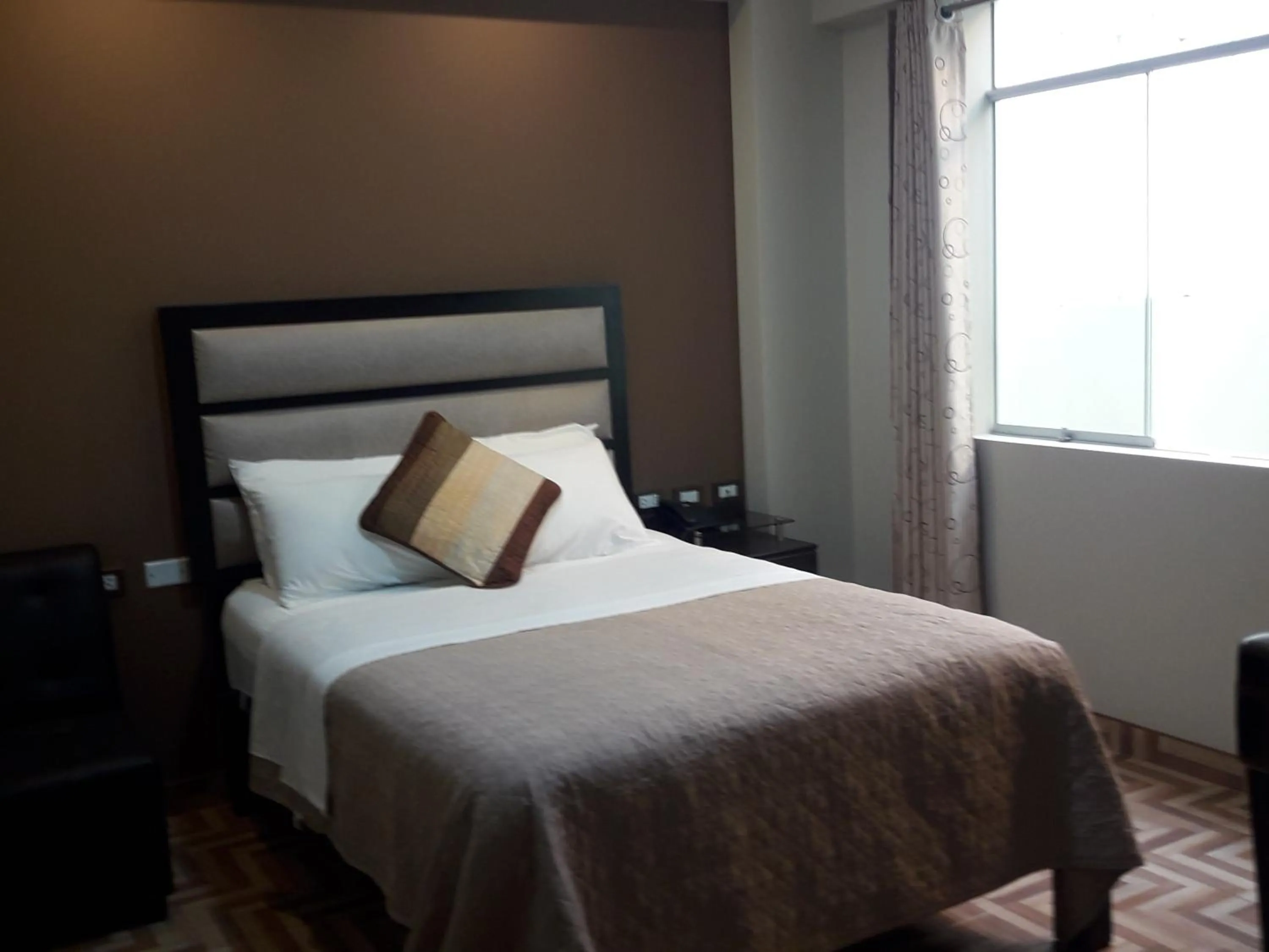 Bed in Gavina Inn Hotel