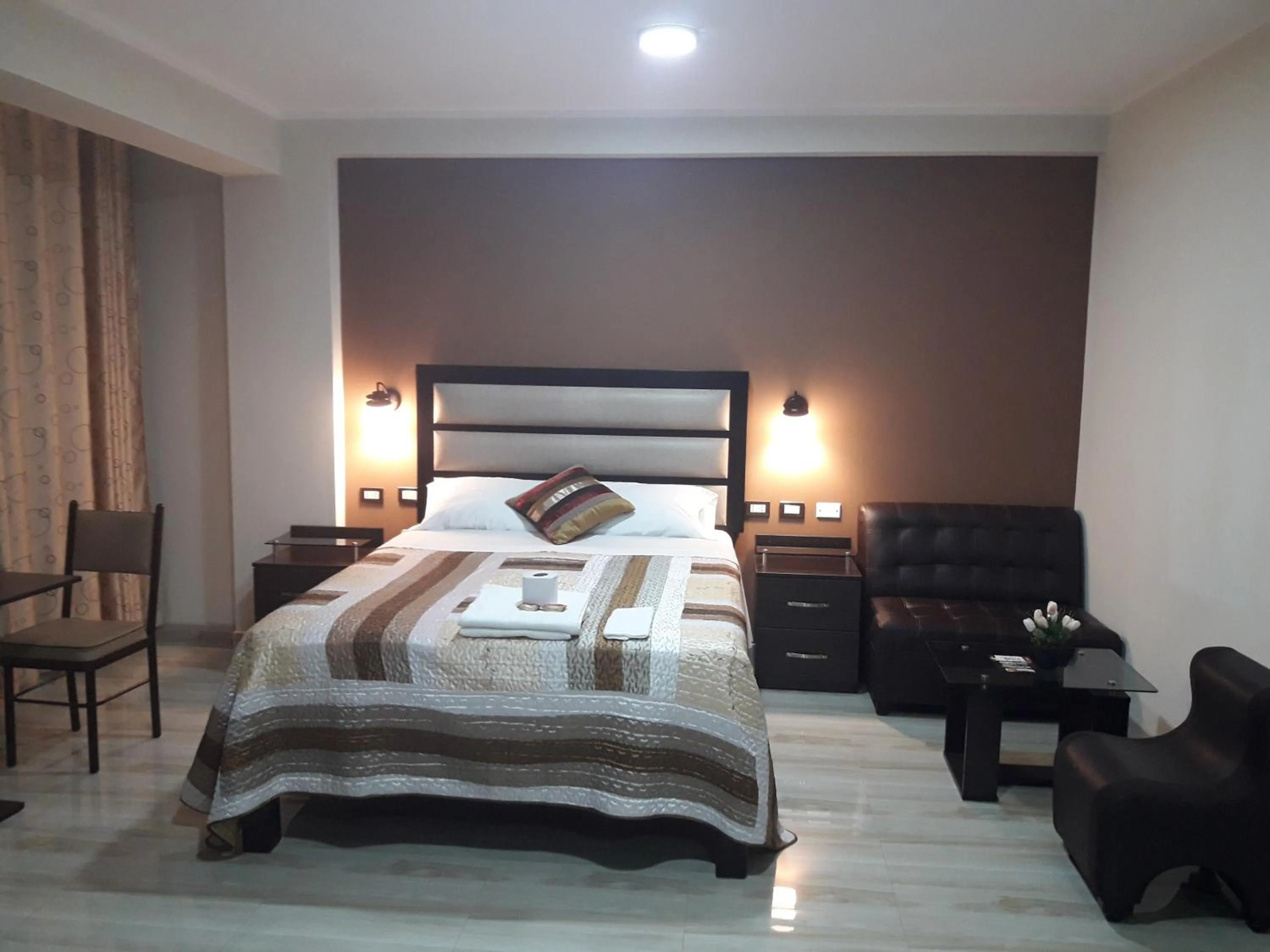 Bed in Gavina Inn Hotel