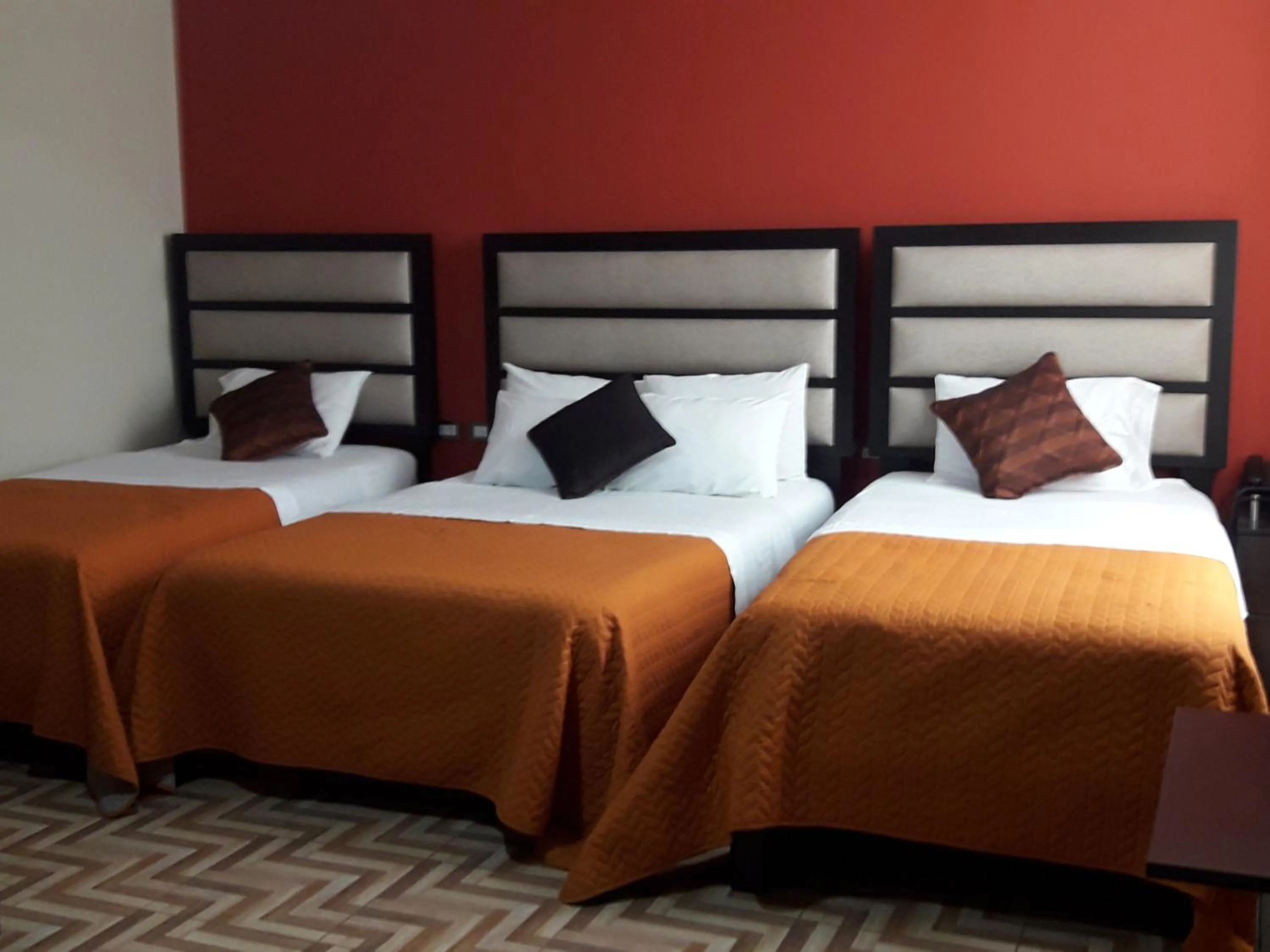 Bed in Gavina Inn Hotel