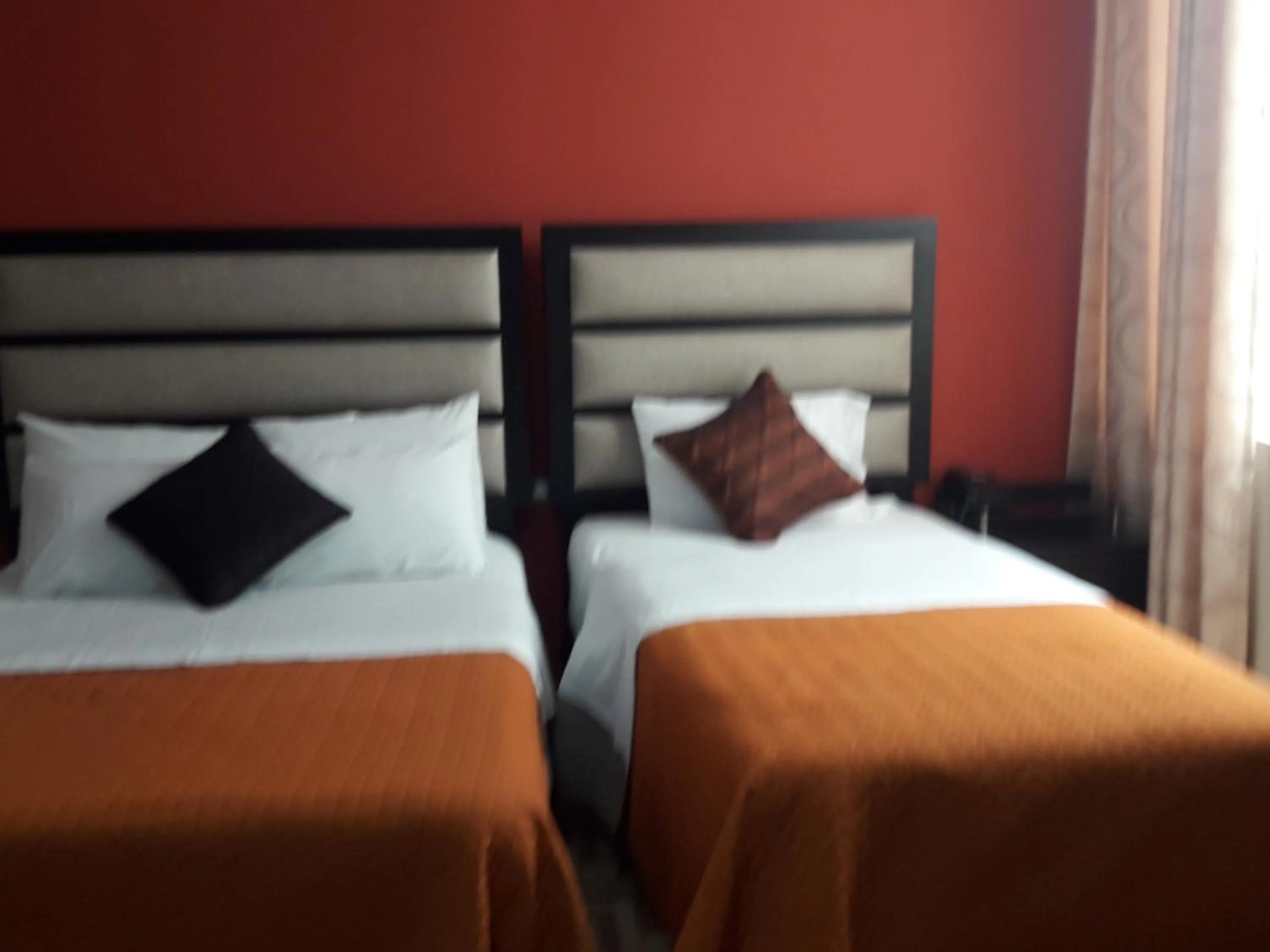 Bed in Gavina Inn Hotel