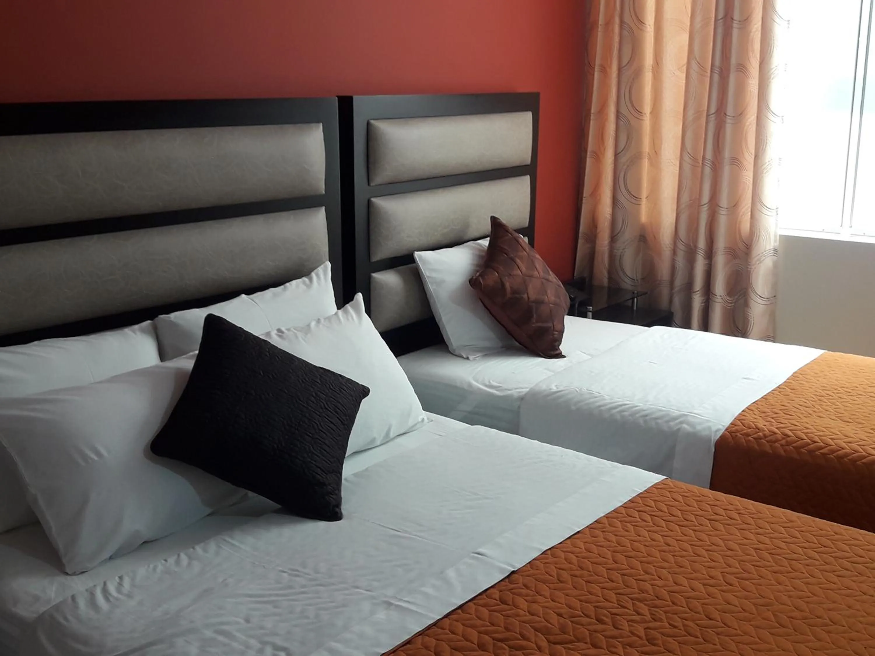 Bed in Gavina Inn Hotel