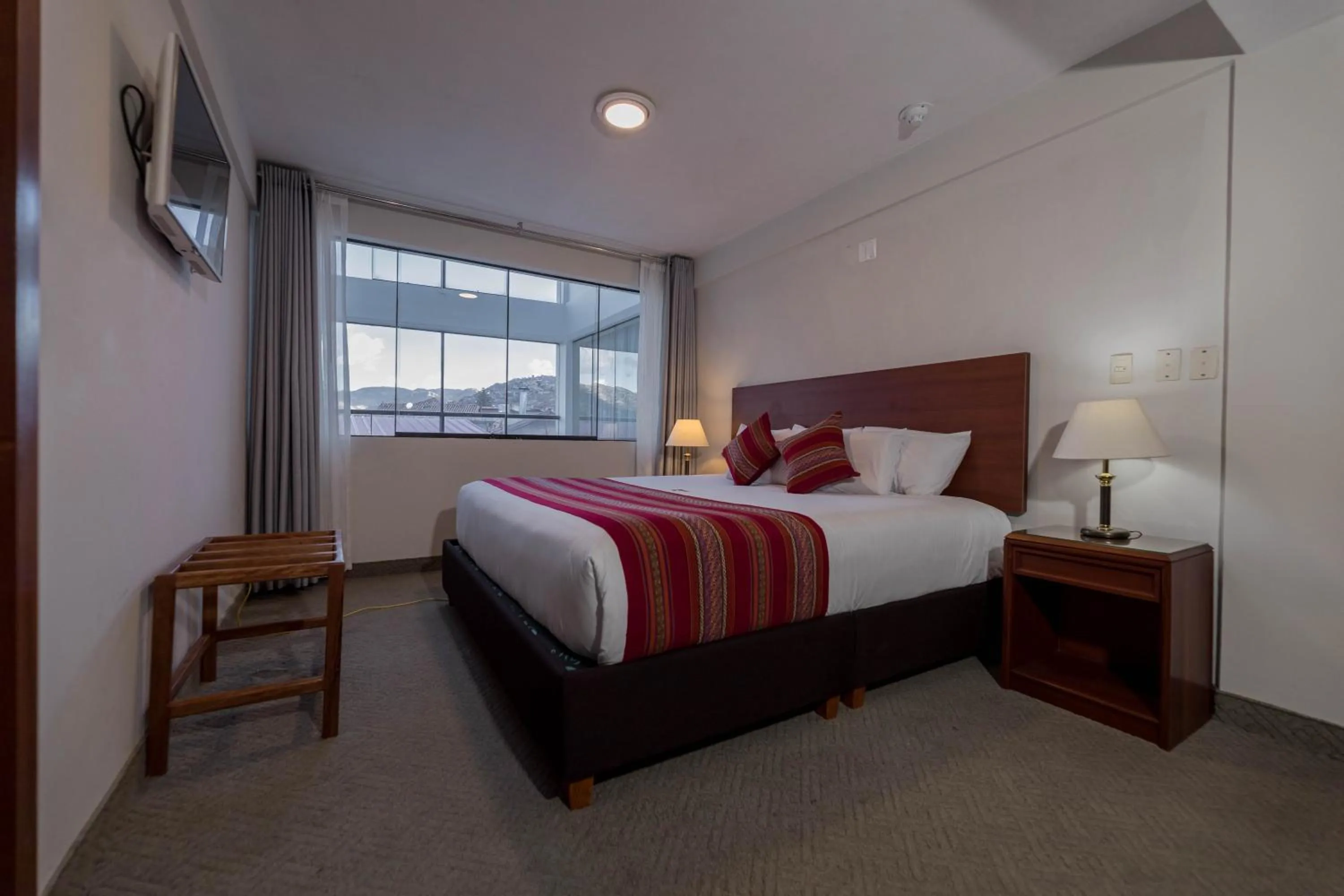 Bed in Quechua Plaza Hotel