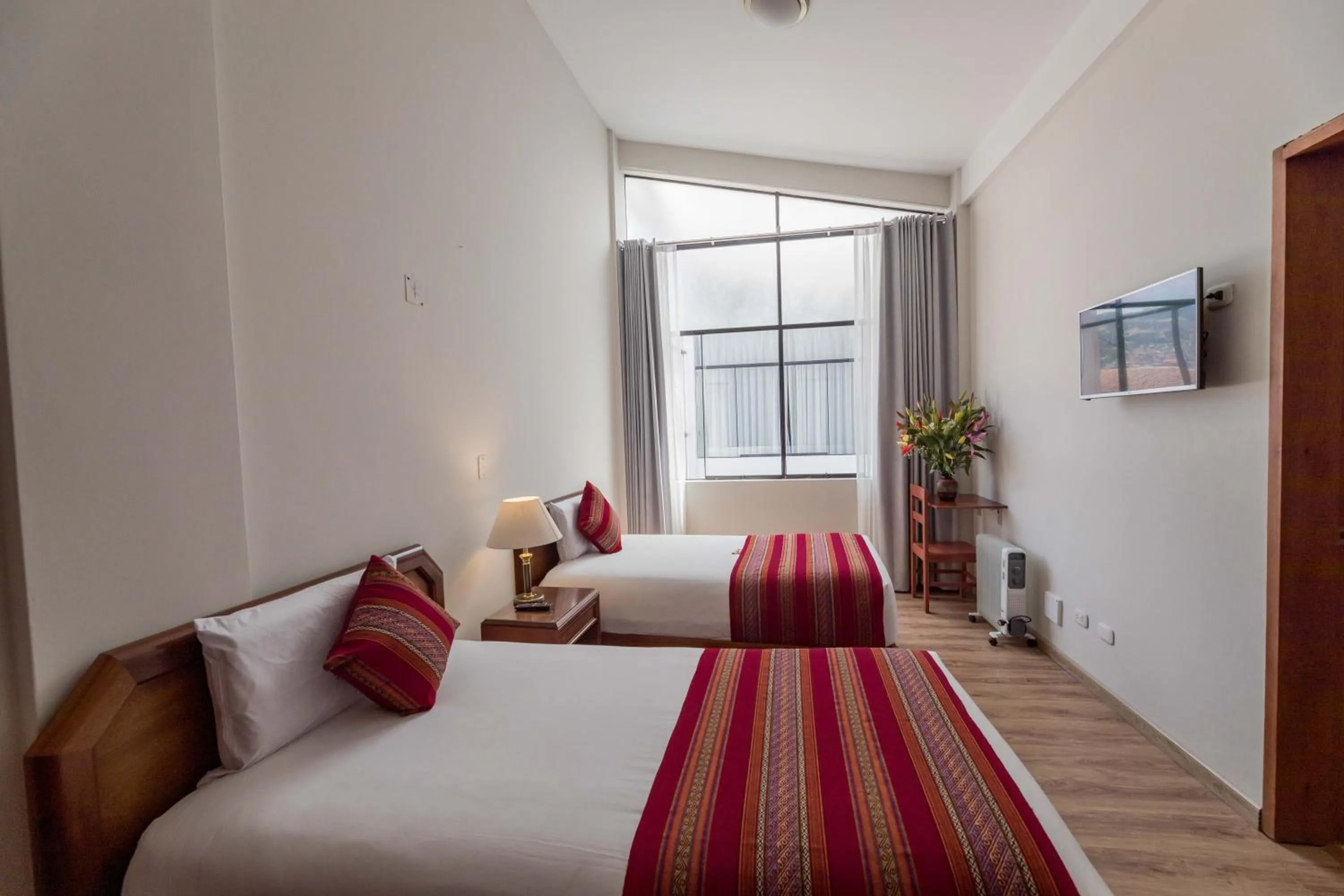 Bed in Quechua Plaza Hotel