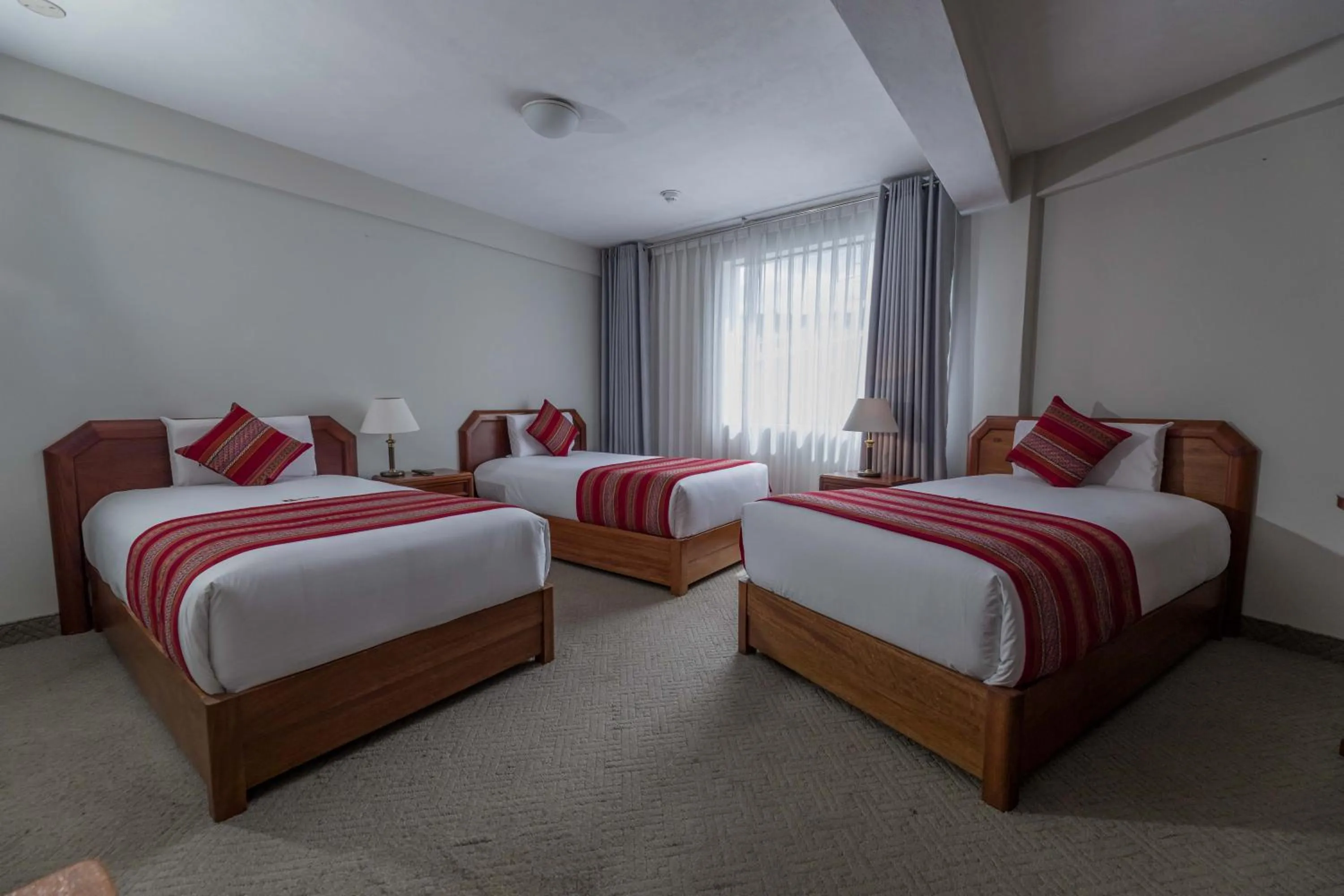 Bed in Quechua Plaza Hotel