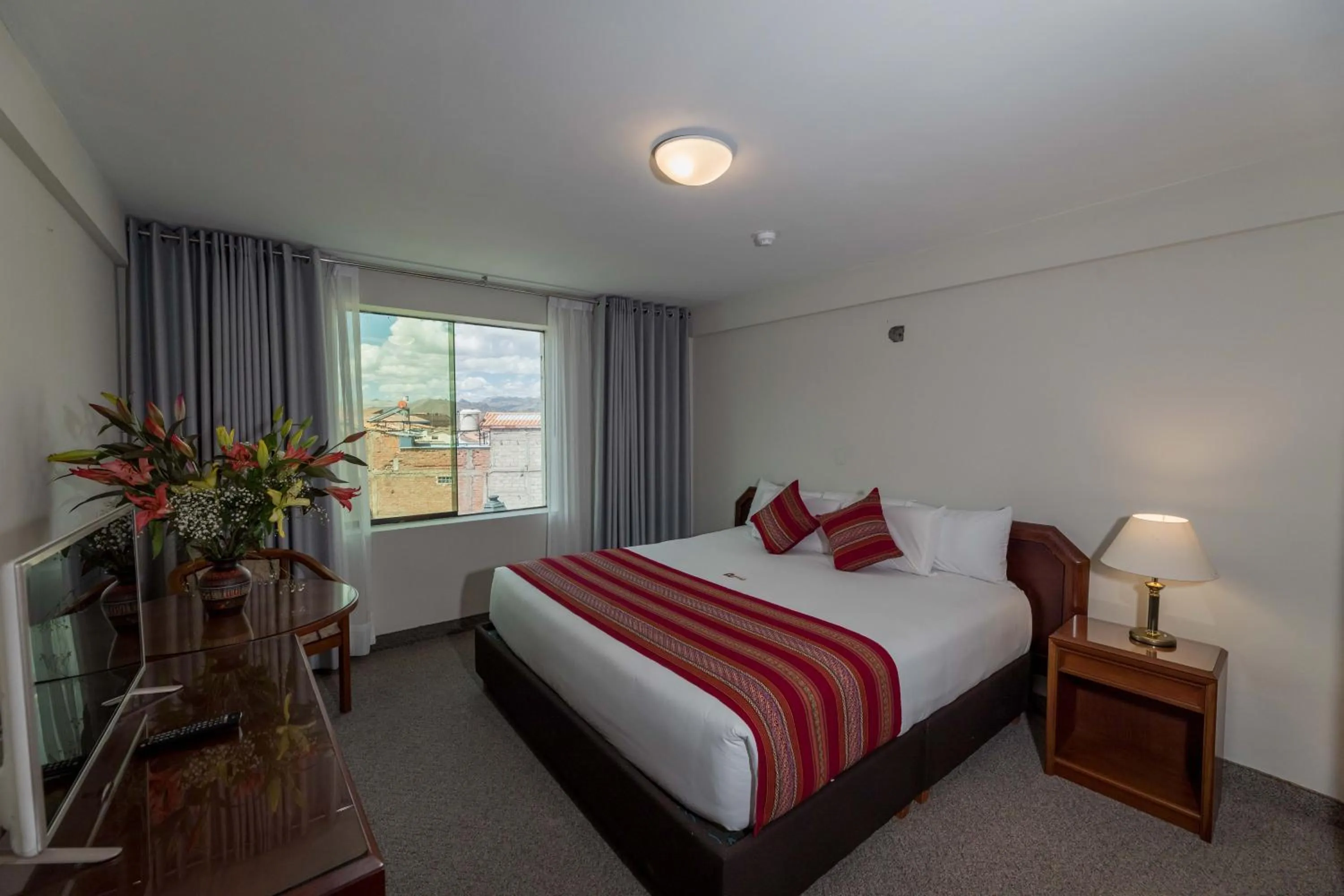 Bed in Quechua Plaza Hotel