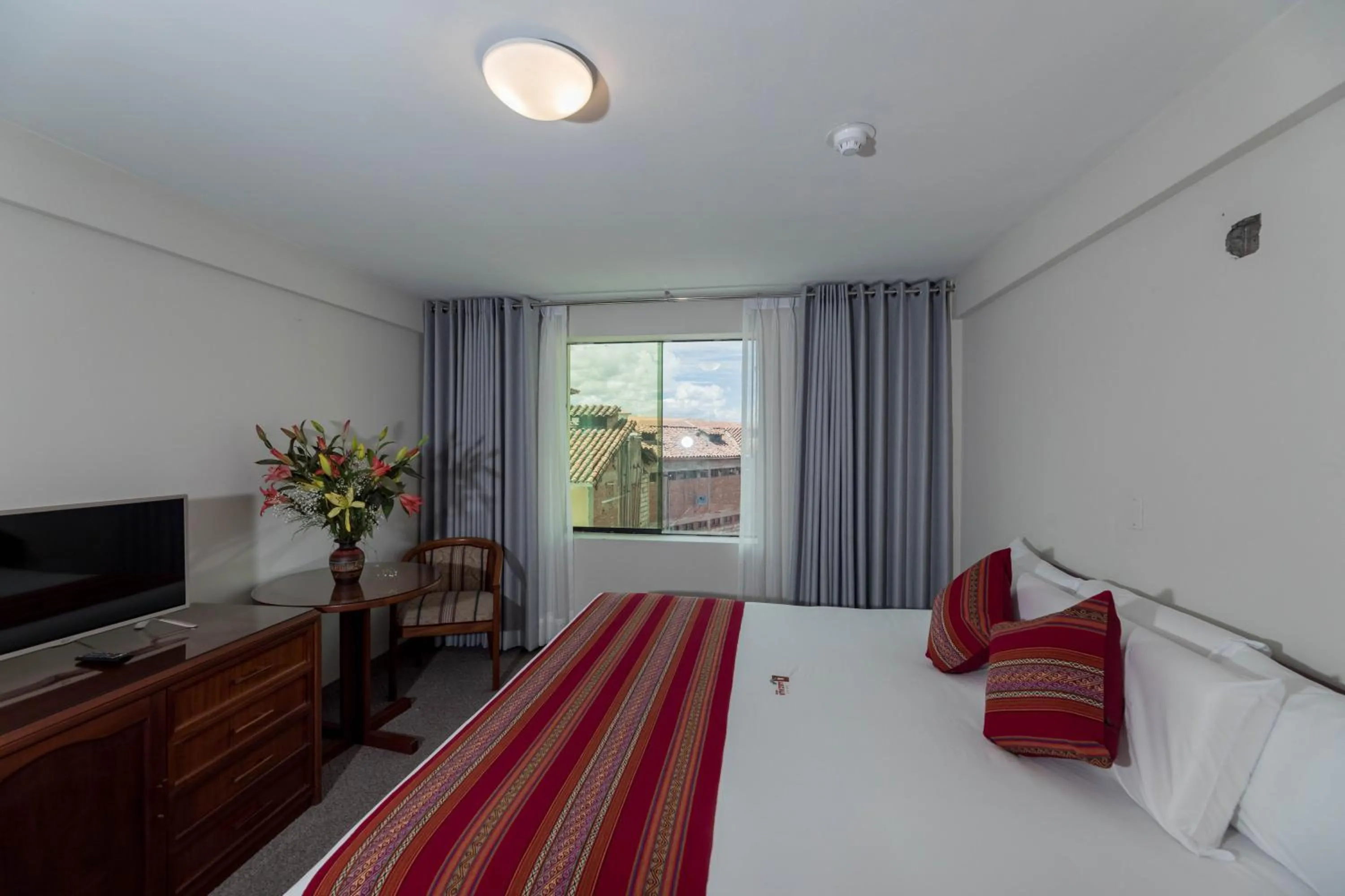 Bed in Quechua Plaza Hotel