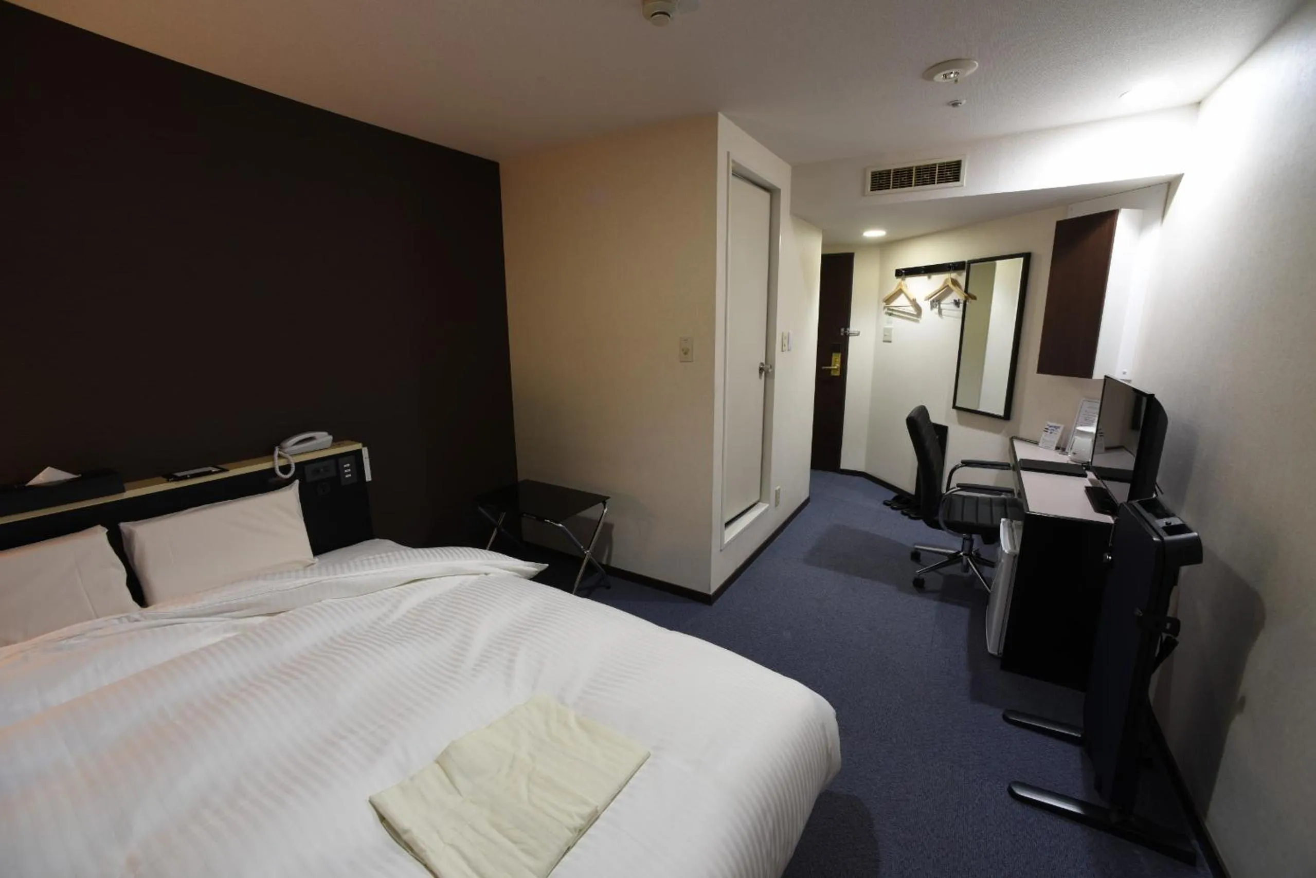 Photo of the whole room, Bed in R Hotels Inn Hokkaido Asahikawa