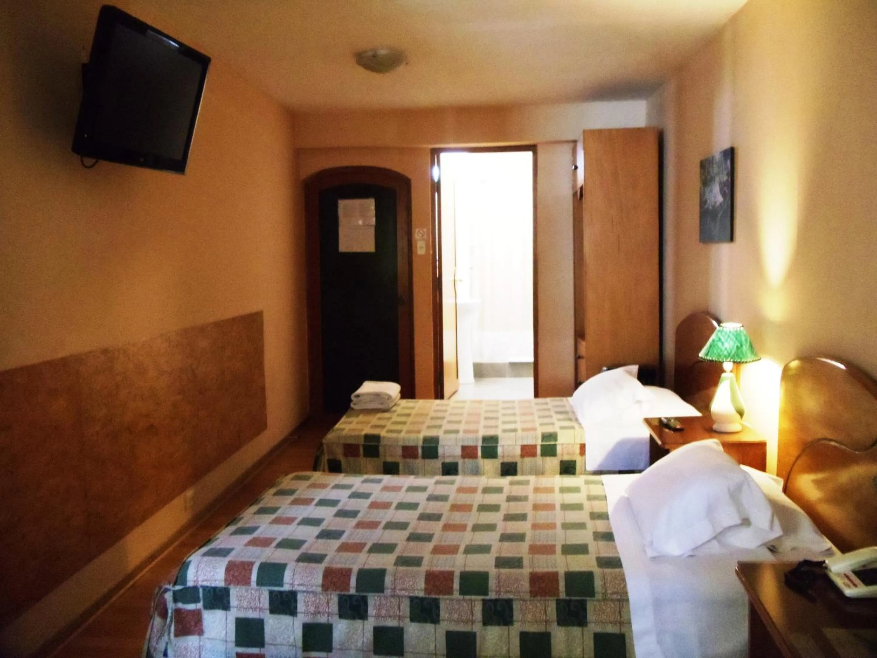 Decorative detail, Bed in Hotel Prisma Cusco