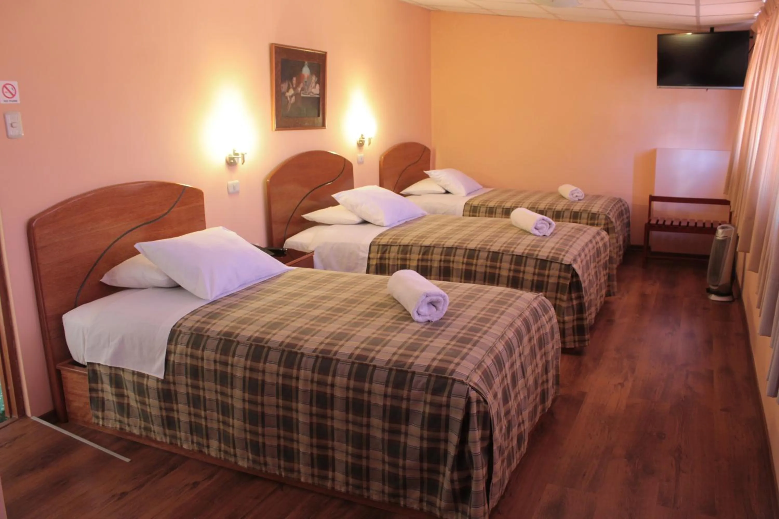 Bed in Hotel Prisma Cusco