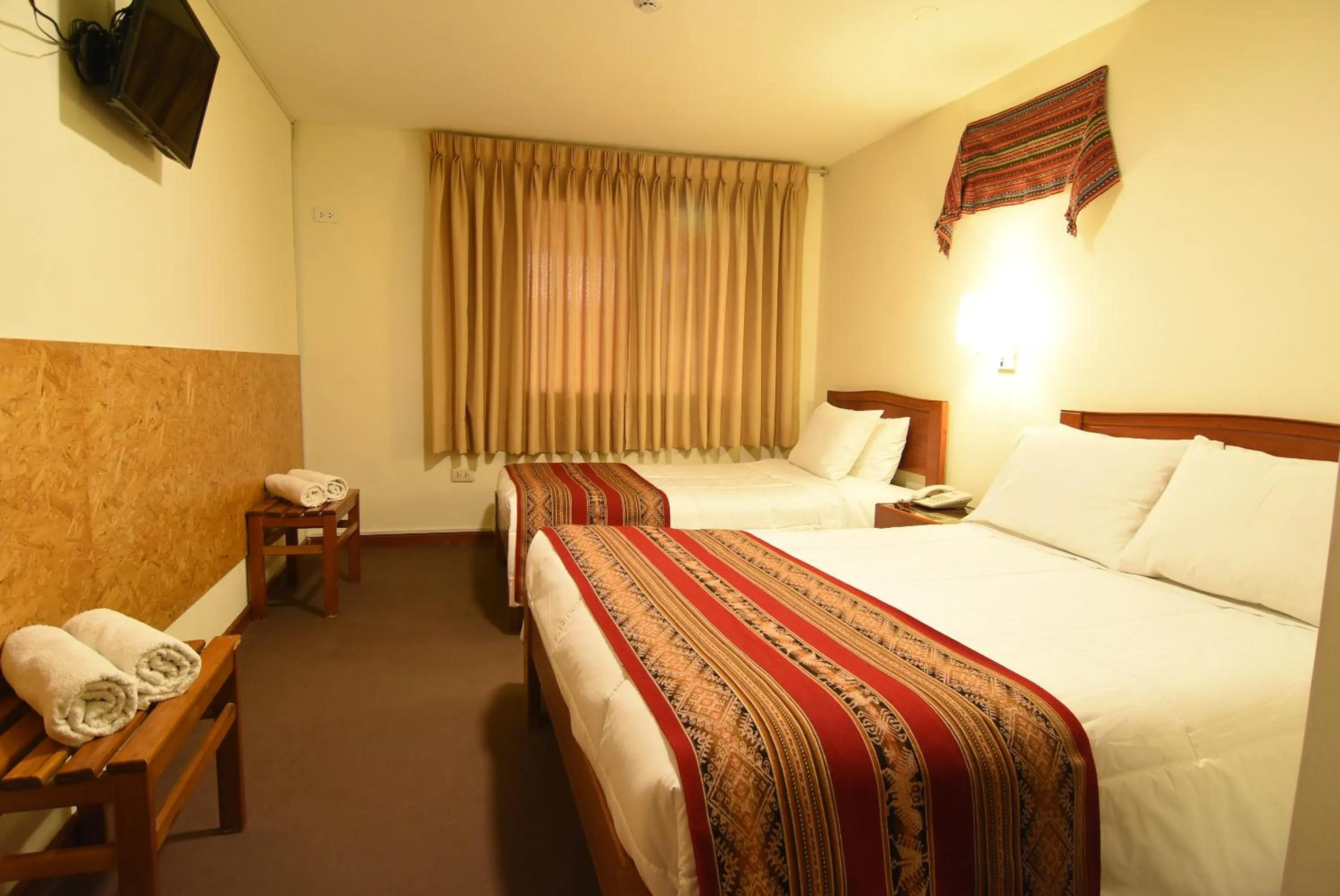 Bed in Hotel Prisma Cusco