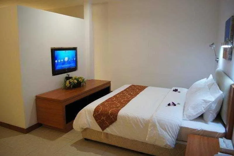 Bed in Gloria Swiss Hotel & Apartment Sandakan