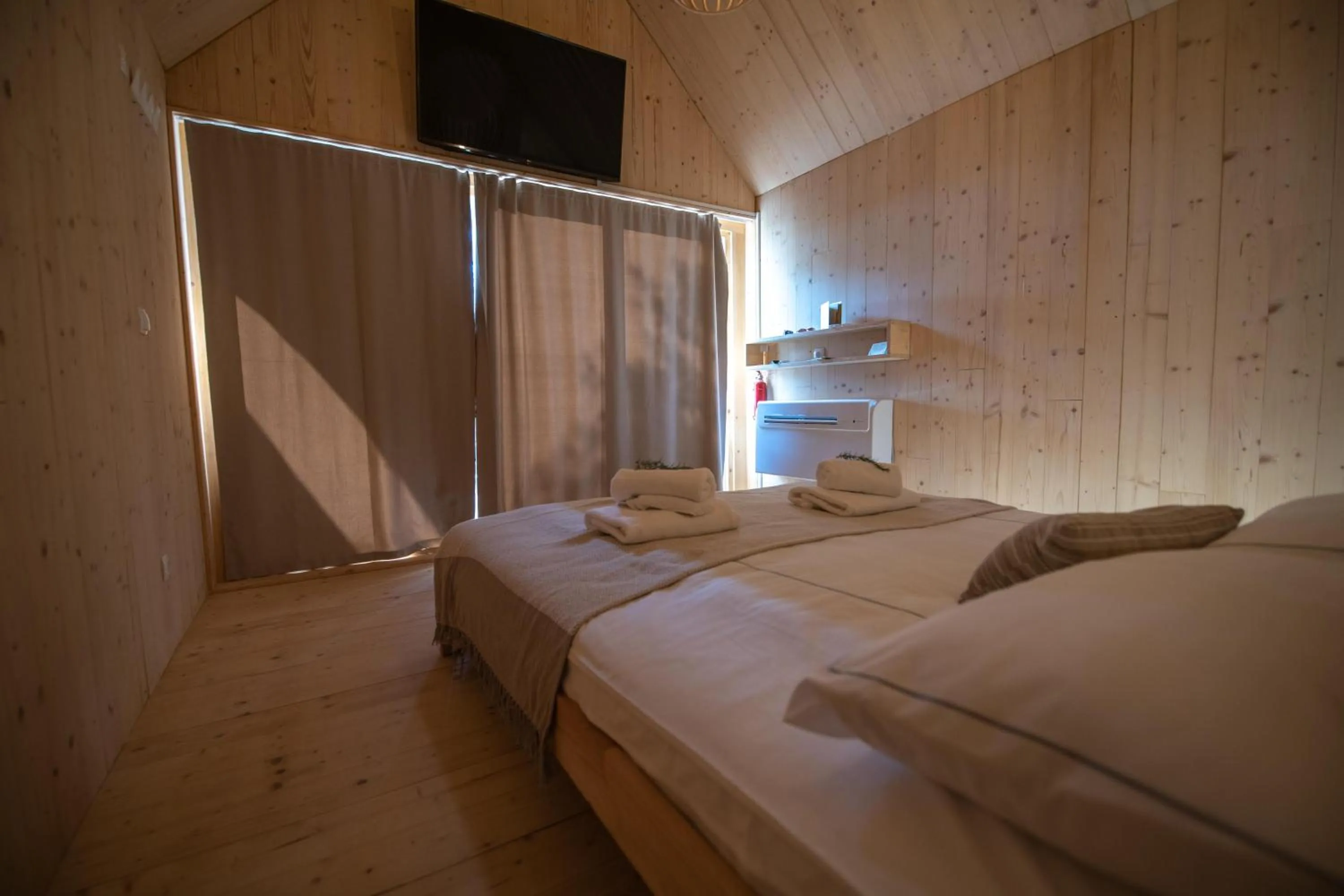 Bed in Arena One 99 Glamping