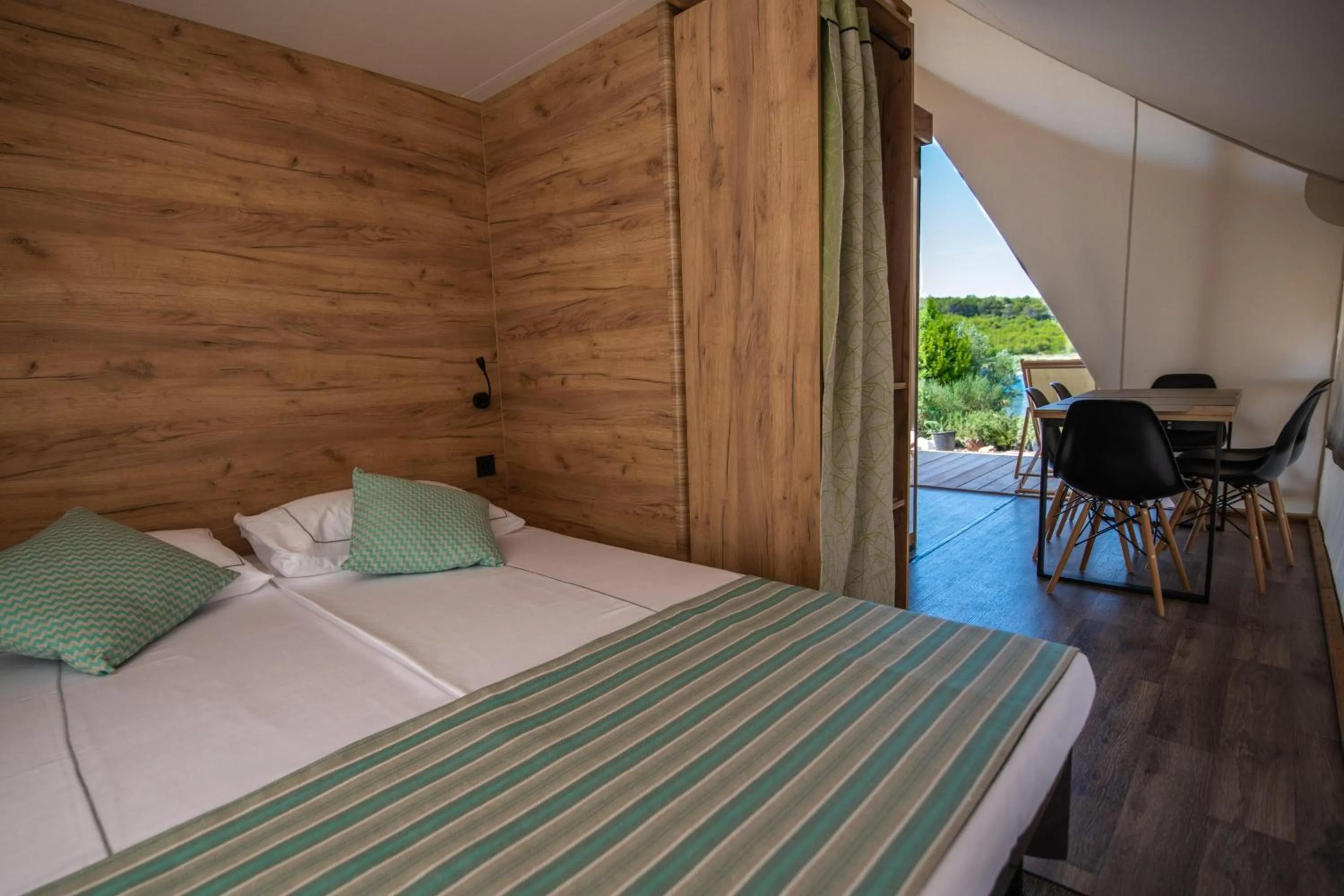 Bed in Arena One 99 Glamping