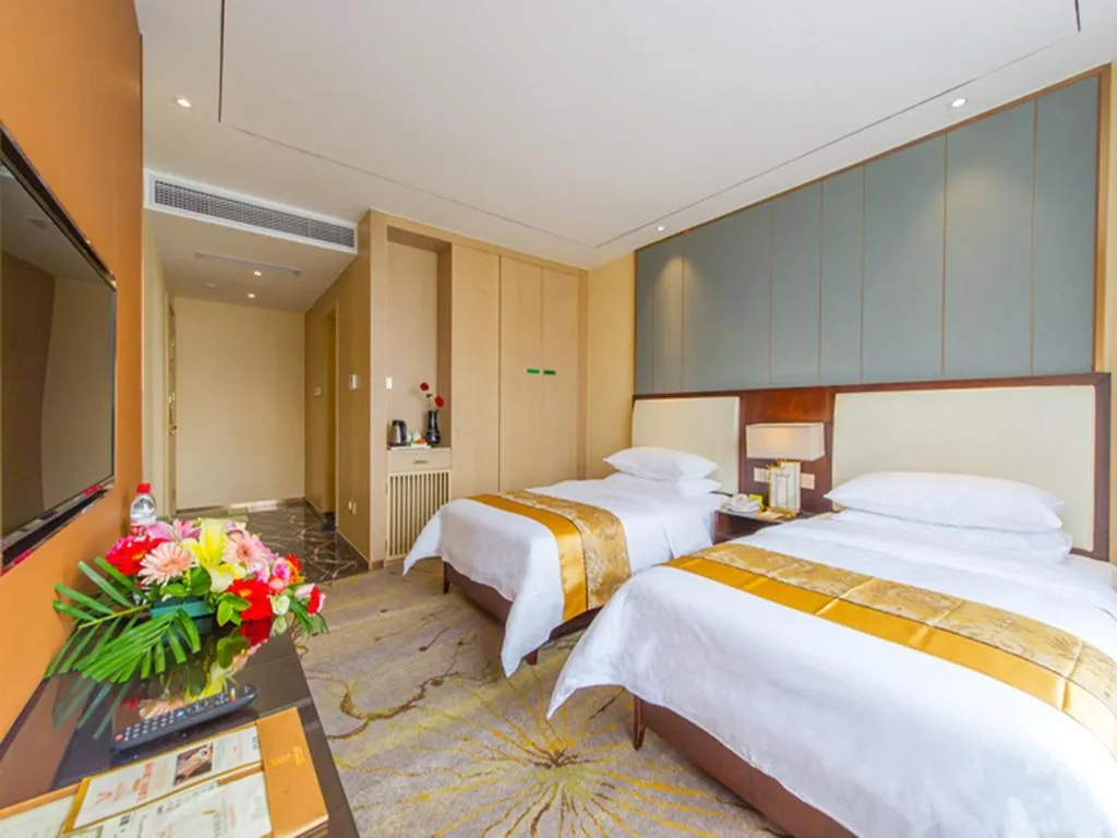 Bed in Vienna International Hotel Diecai Wanda High Speed ​​Rail Station