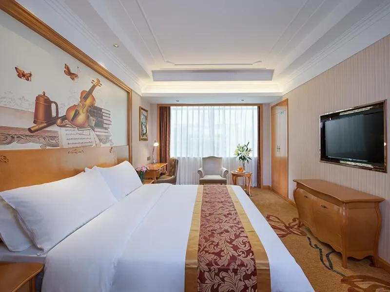 Bed in Venus International Hotel Shenzhen Gongming Tianhong