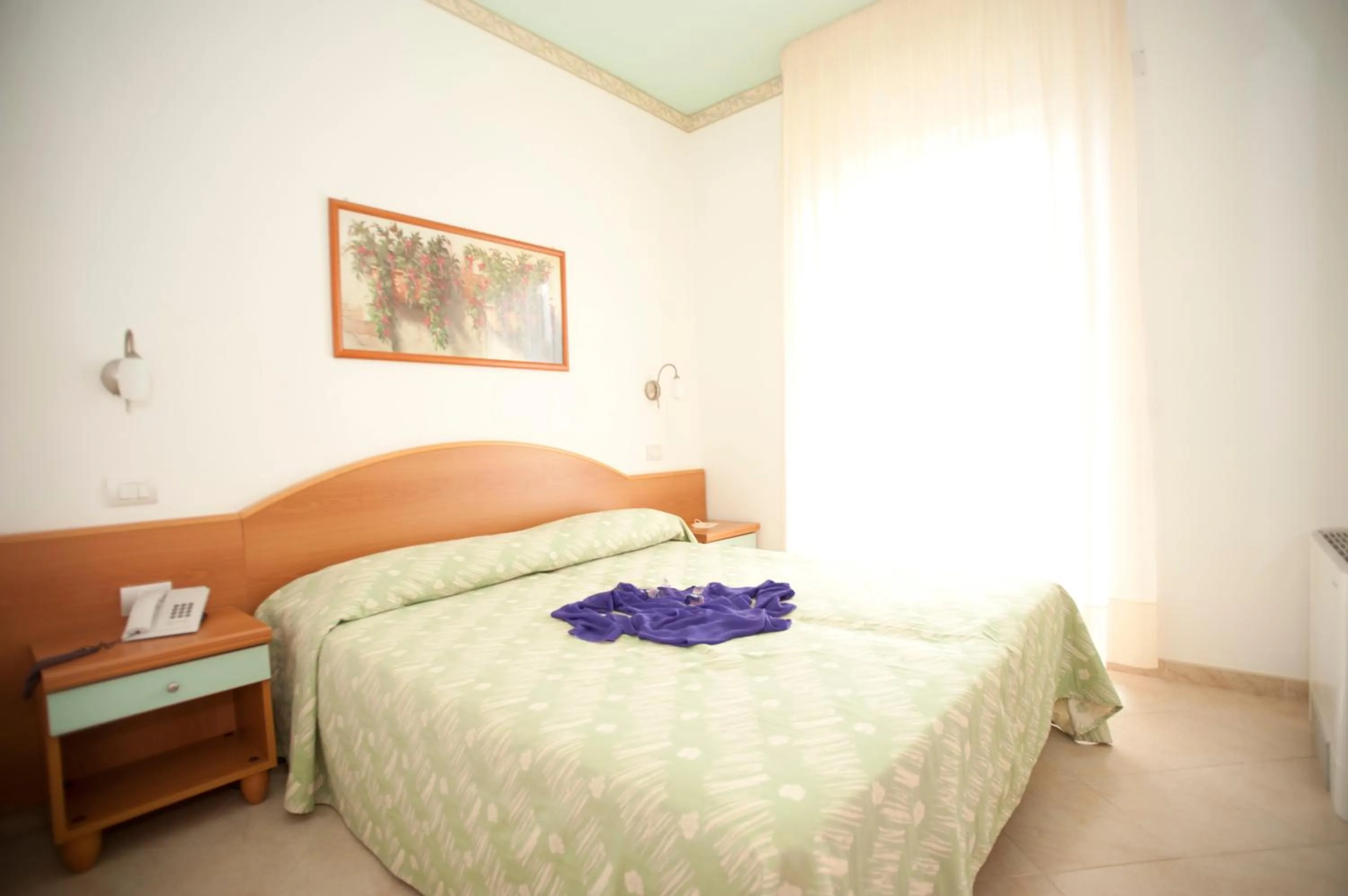 Bed in Oasiclub Hotel