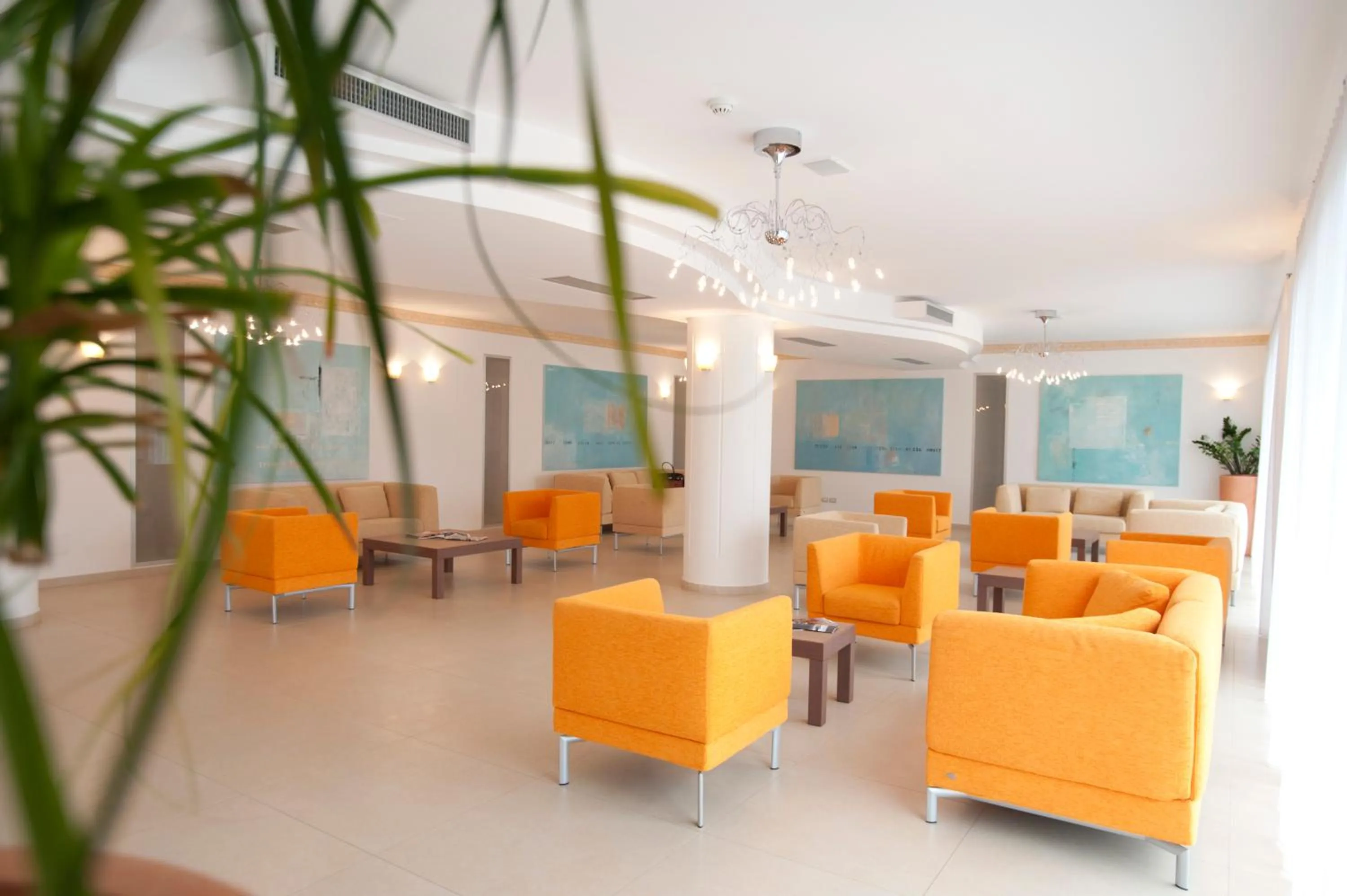 Communal lounge/ TV room in Oasiclub Hotel